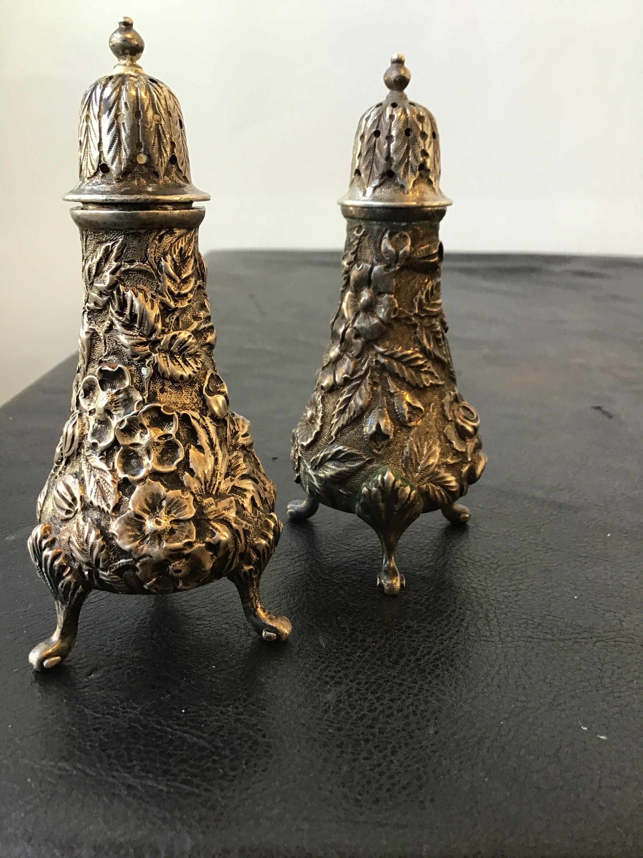 1920s Jacobi and Jenkins sterling repousse salt and pepper shakers. Weighs 4.8 ounces.