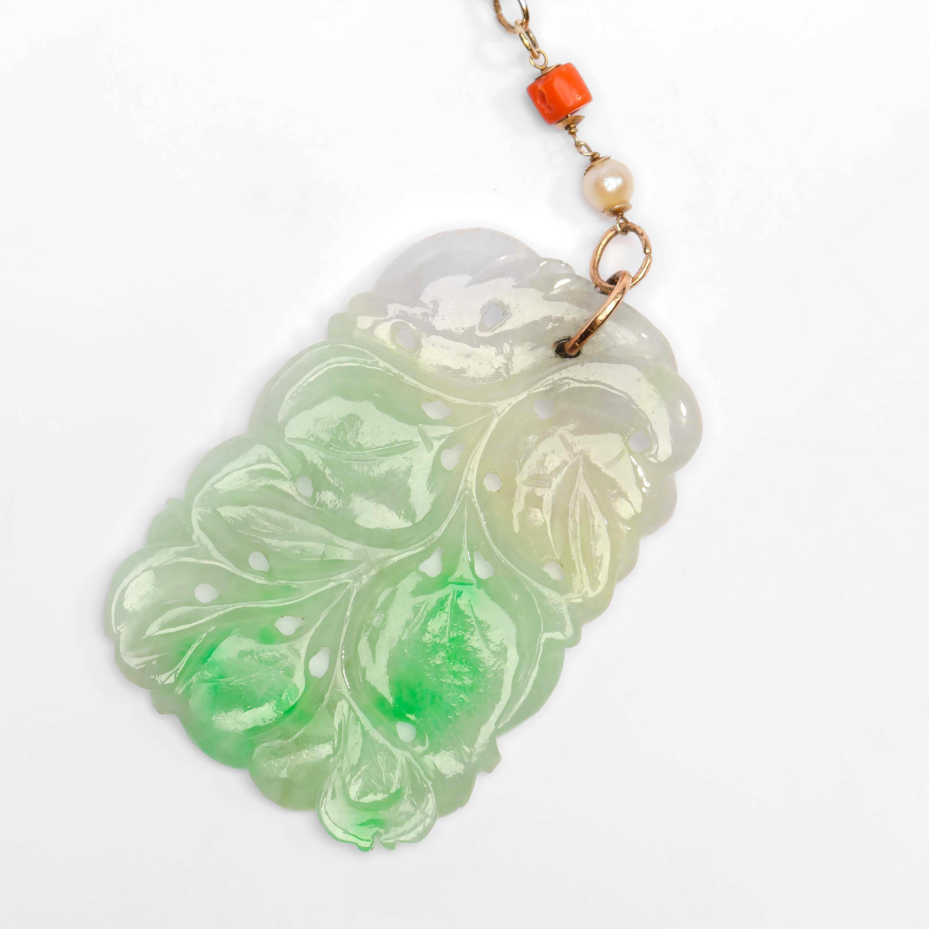 I don't even know where to start with this piece so maybe we'll start in the middle. Directly above the carved white and green —moss in snow— carved jadeite jade plaque is a soft green carved jadeite jade pi or bi disk. This disk is suspended from a