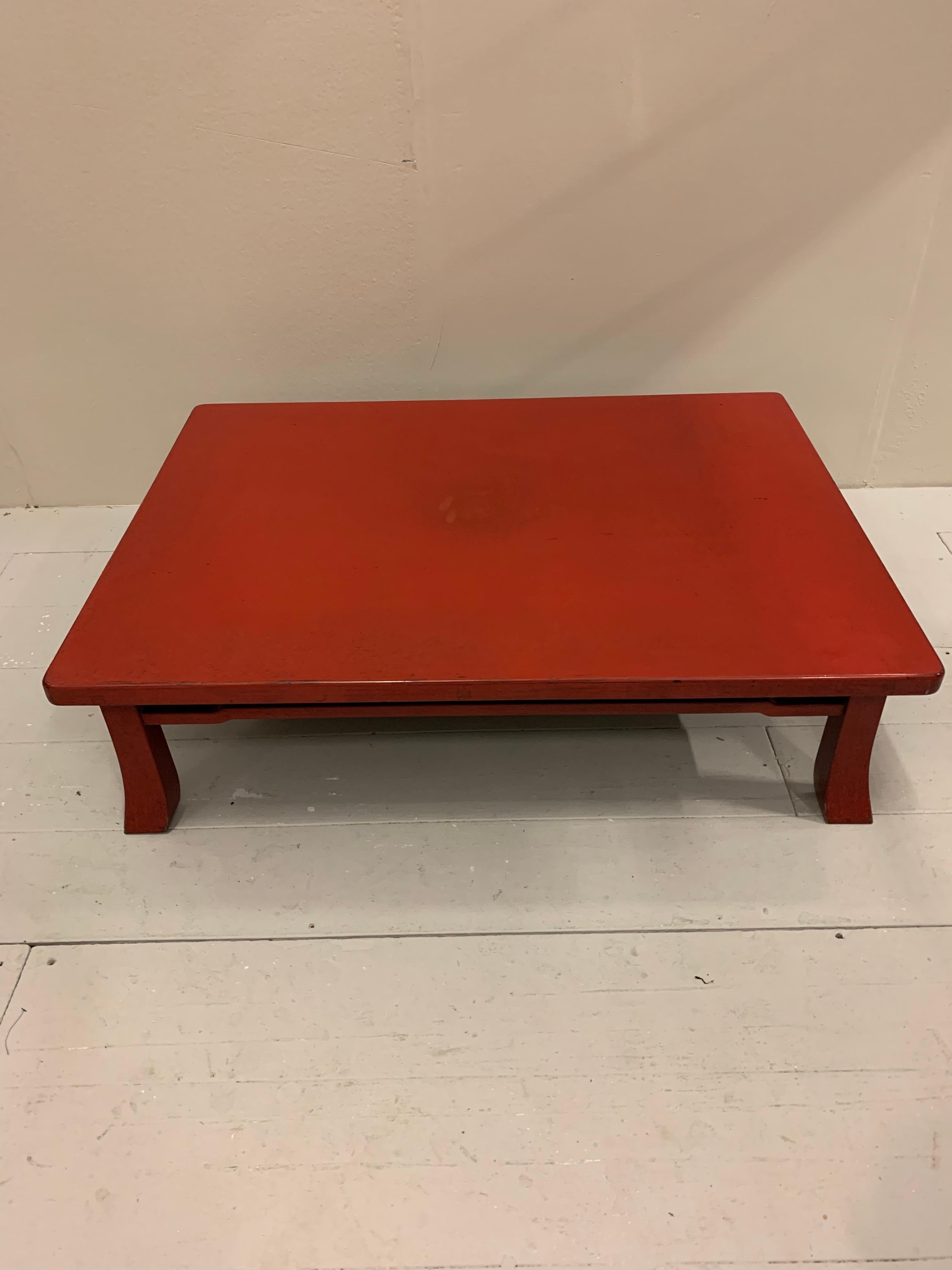 This is a great size and colour red Japanese negora lacquered coffee table.
There are small signs of wear which comes with age and use but overall it is in very good condition.
The deep classically understated oriental design would be a useful