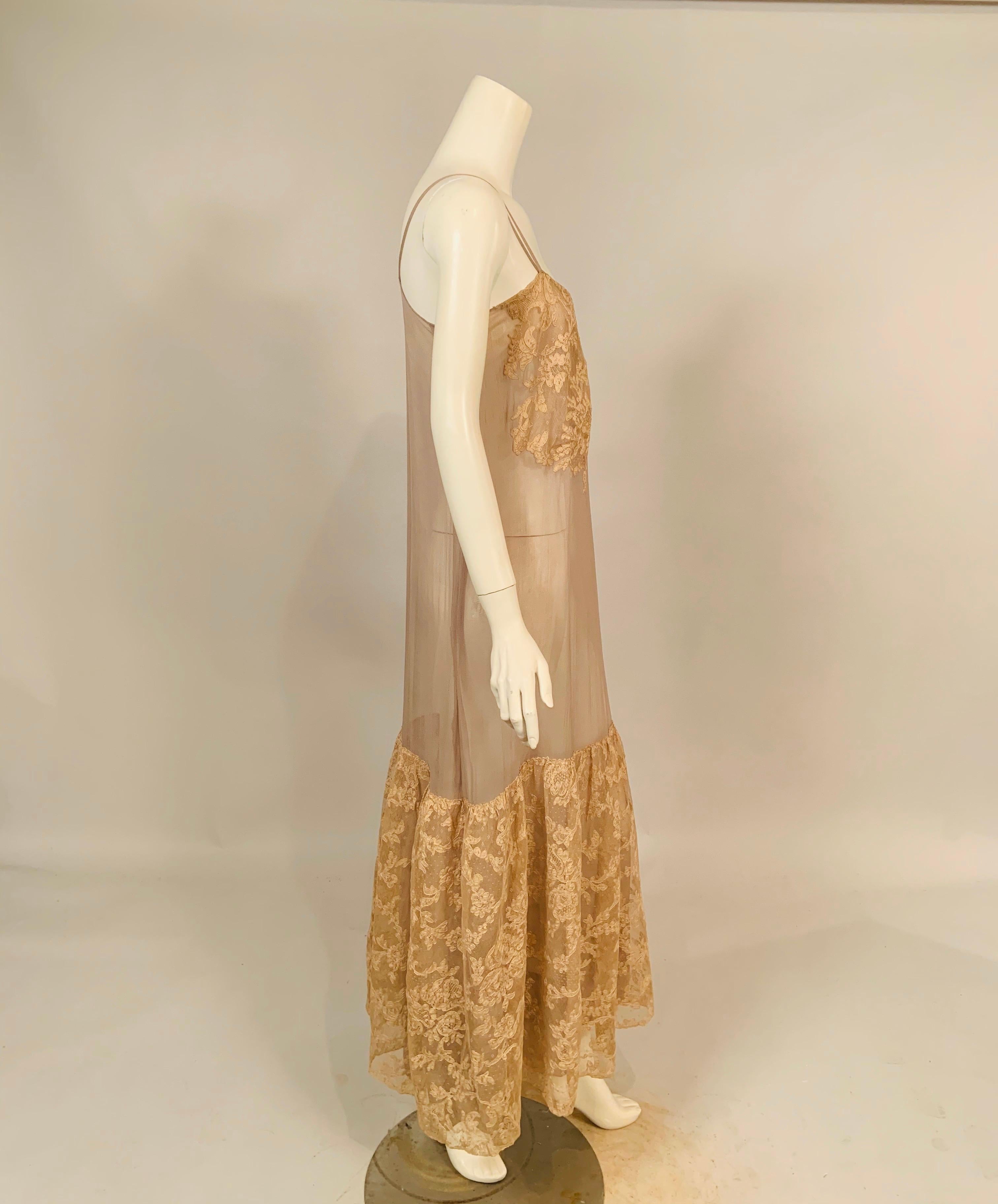 This stunning and ultra feminine 1920's lavender silk chiffon slip, or slip dress, is lavishly trimmed with Alencon lace appliqued on the top and a matching deep flounce at the bottom of the slip. It is all hand finished and is in excellent