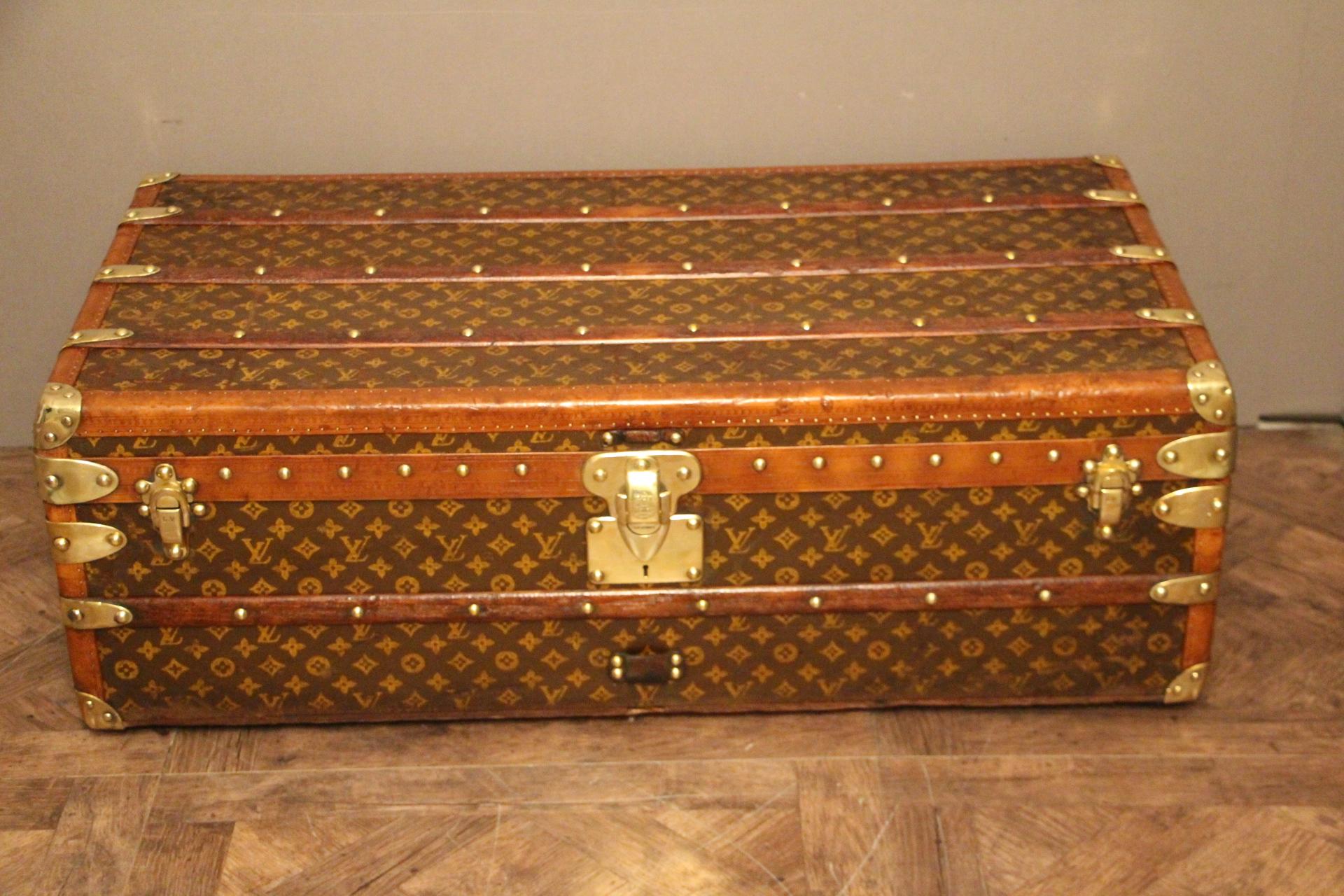This beautiful Louis Vuitton trunk features stenciled hand painted monogramm canvas and lozine trim.
All solid brass LV stamped studs and locks as well as solid brass corners
Leather handles on each side.
Its interior is all original except that