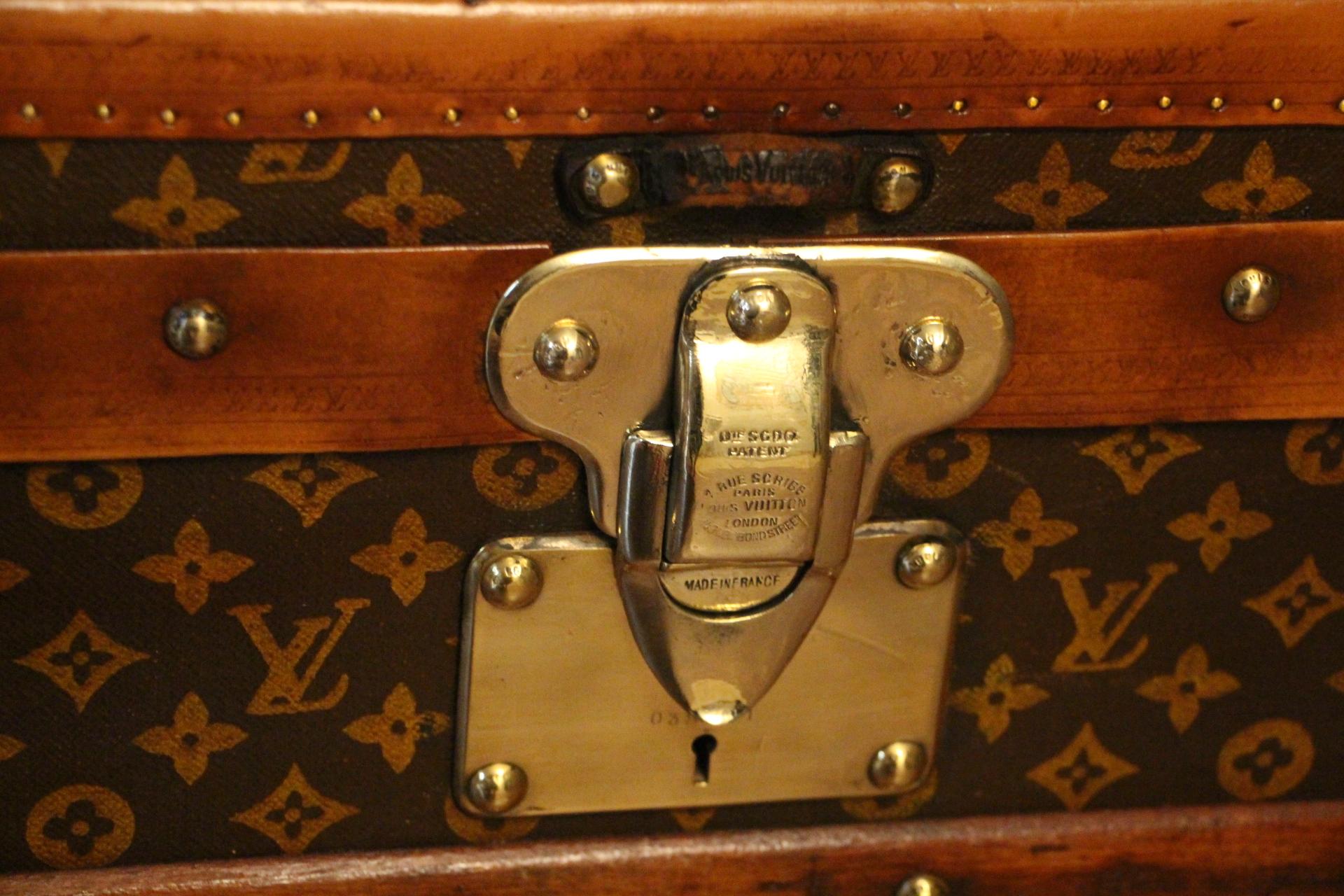 This beautiful Louis Vuitton trunk features stenciled hand painted monogram canvas and lozine trim.
All solid brass LV stamped studs and locks as well as solid brass corners
Leather handles on each side.
Its interior is all original and very