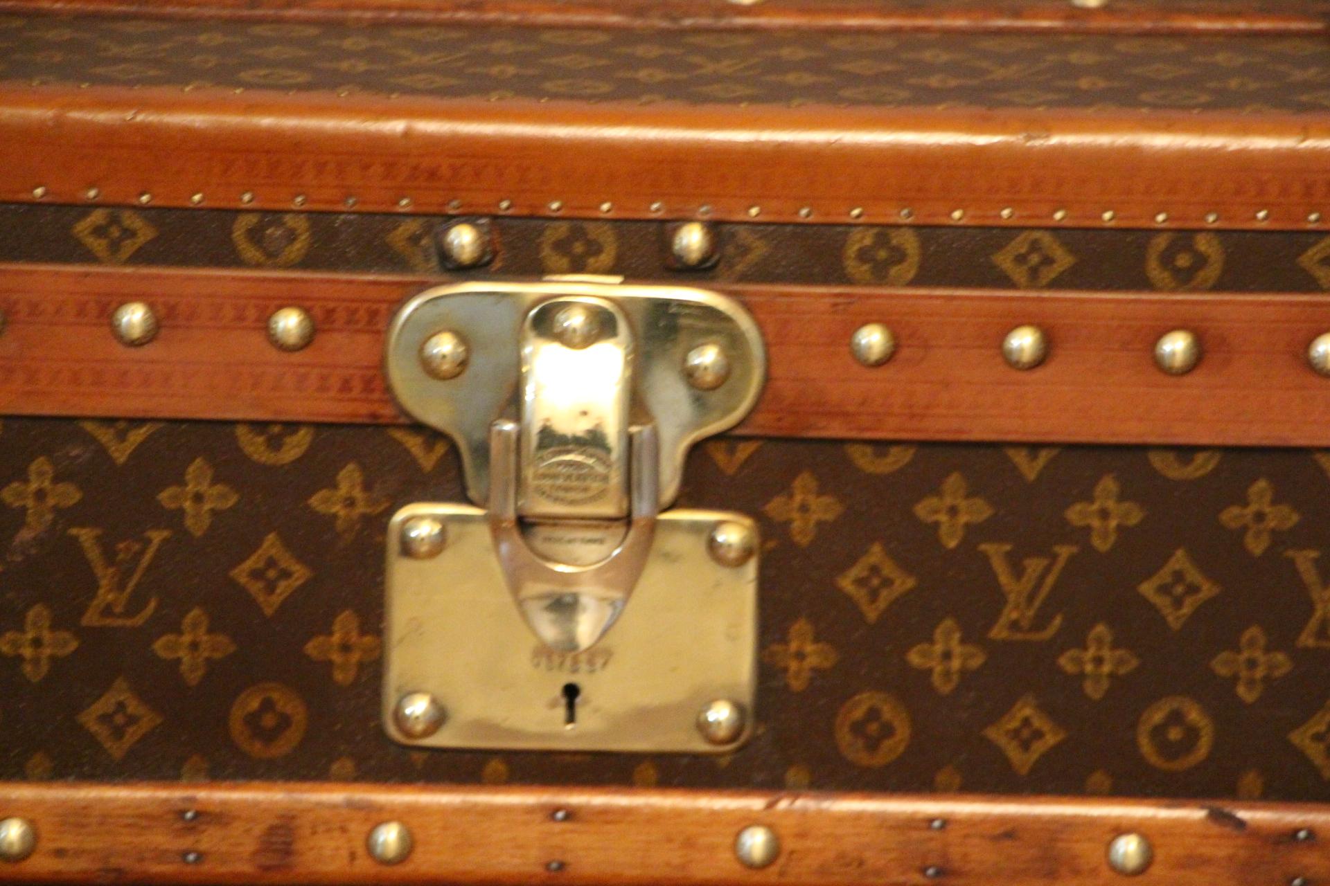 This beautiful Louis Vuitton trunk features stenciled hand painted monogram canvas and honey color lozine trim.
All solid brass LV stamped studs and locks as well as solid brass corners.
Leather handles on each side.
Its interior is all original