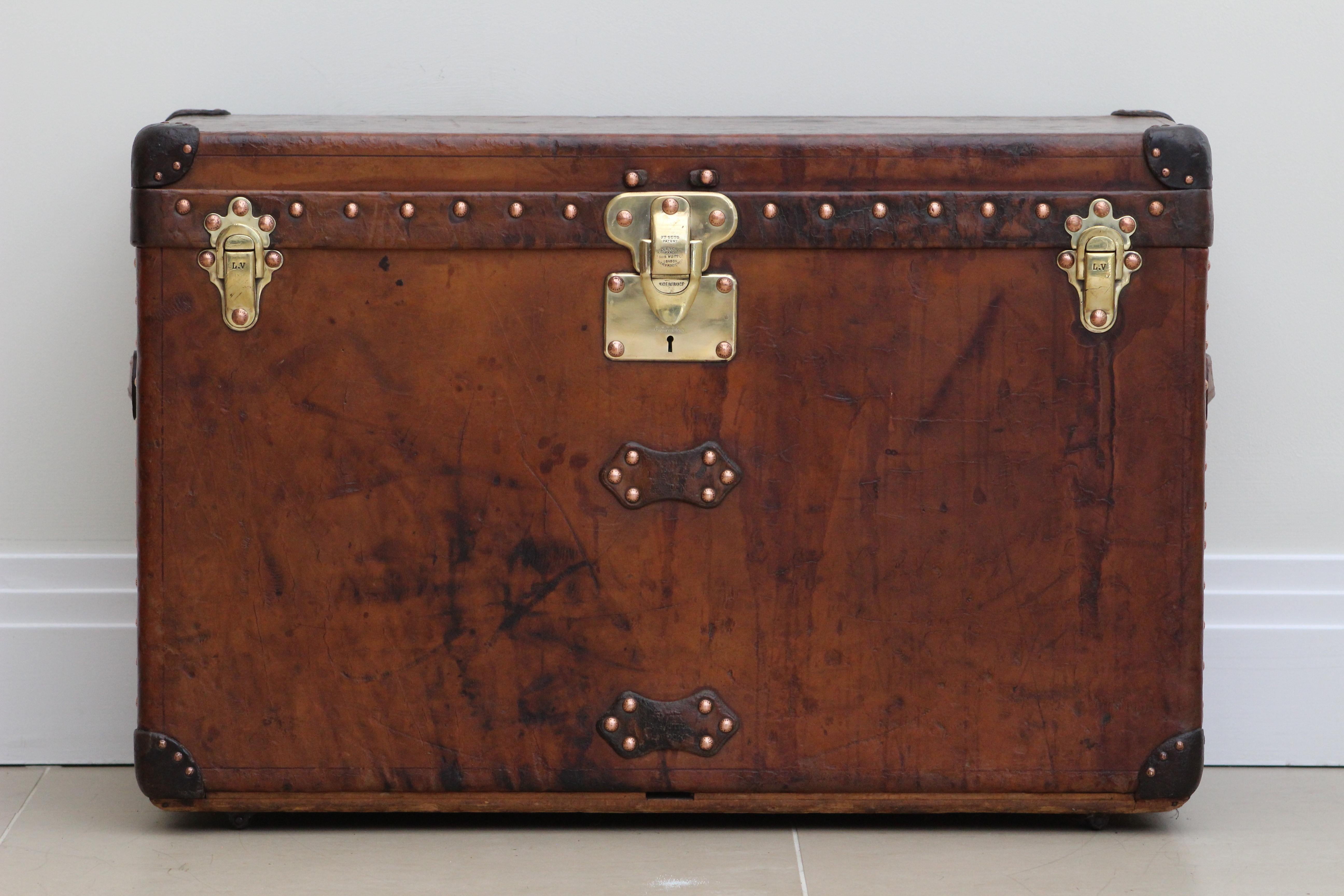 The 1920s Louis Vuitton Cowhide Leather Custom Trunk is a true embodiment of luxury, craftsmanship, and personal history. An artifact from a time when travel was a grand affair, this trunk is a perfect blend of form, function, and artistry, echoing
