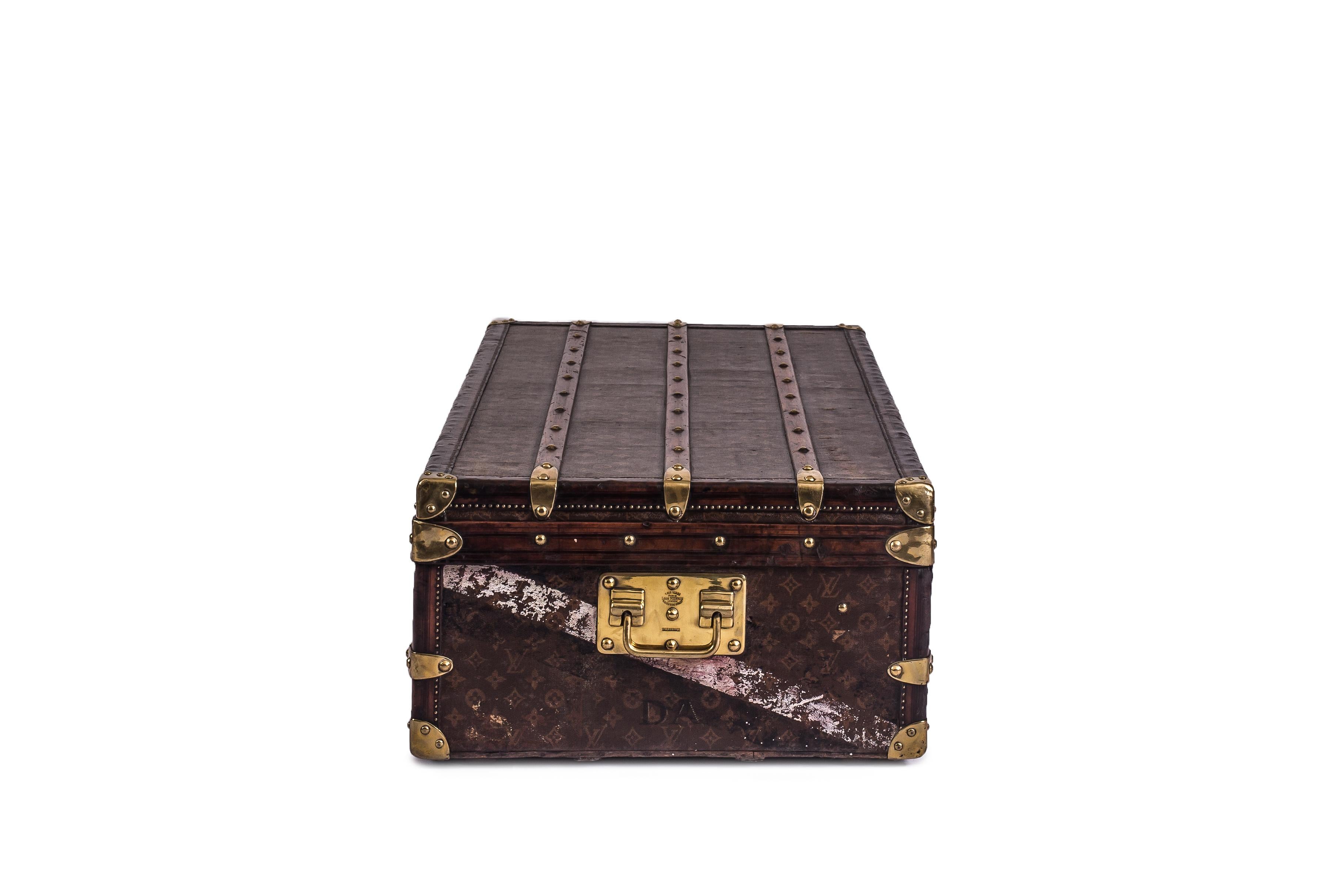 A beautiful trunk that is entirely covered by the signature monogrammed canvas from Louis Vuitton circa 1920s. The monogram canvas shows some loss and scratches on the top of the trunk.

It features:
- Leather trim, 
- Brass hardware. 
- leather