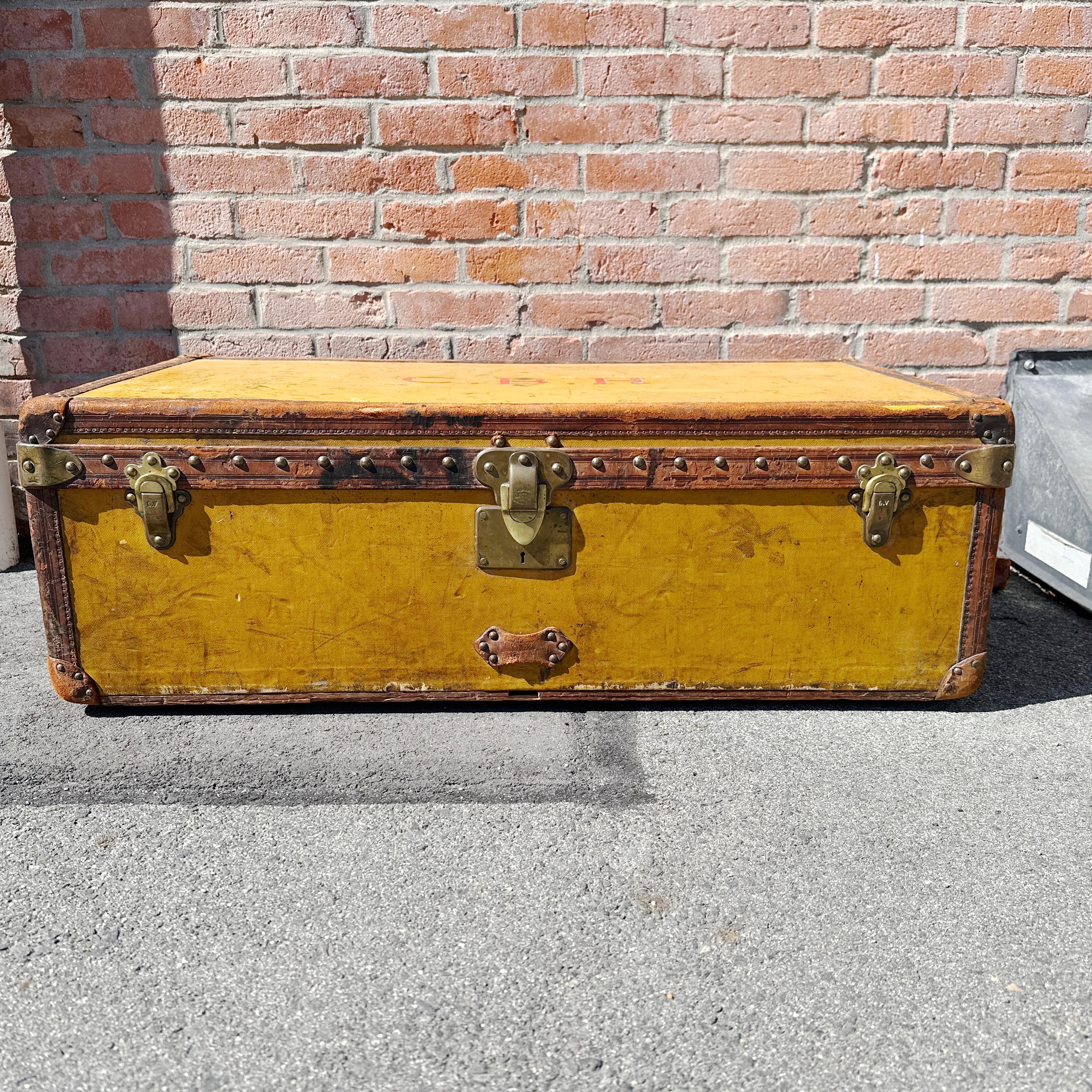 A fabulous and rare 1920s LOUIS VUITTON Orange Vuittonite Cabin Steamer Trunk. It is made with the famous Vuittonite canvas with leather trim and handles. The orange canvas has “turned” to yellow with the effect of time and light which gives this