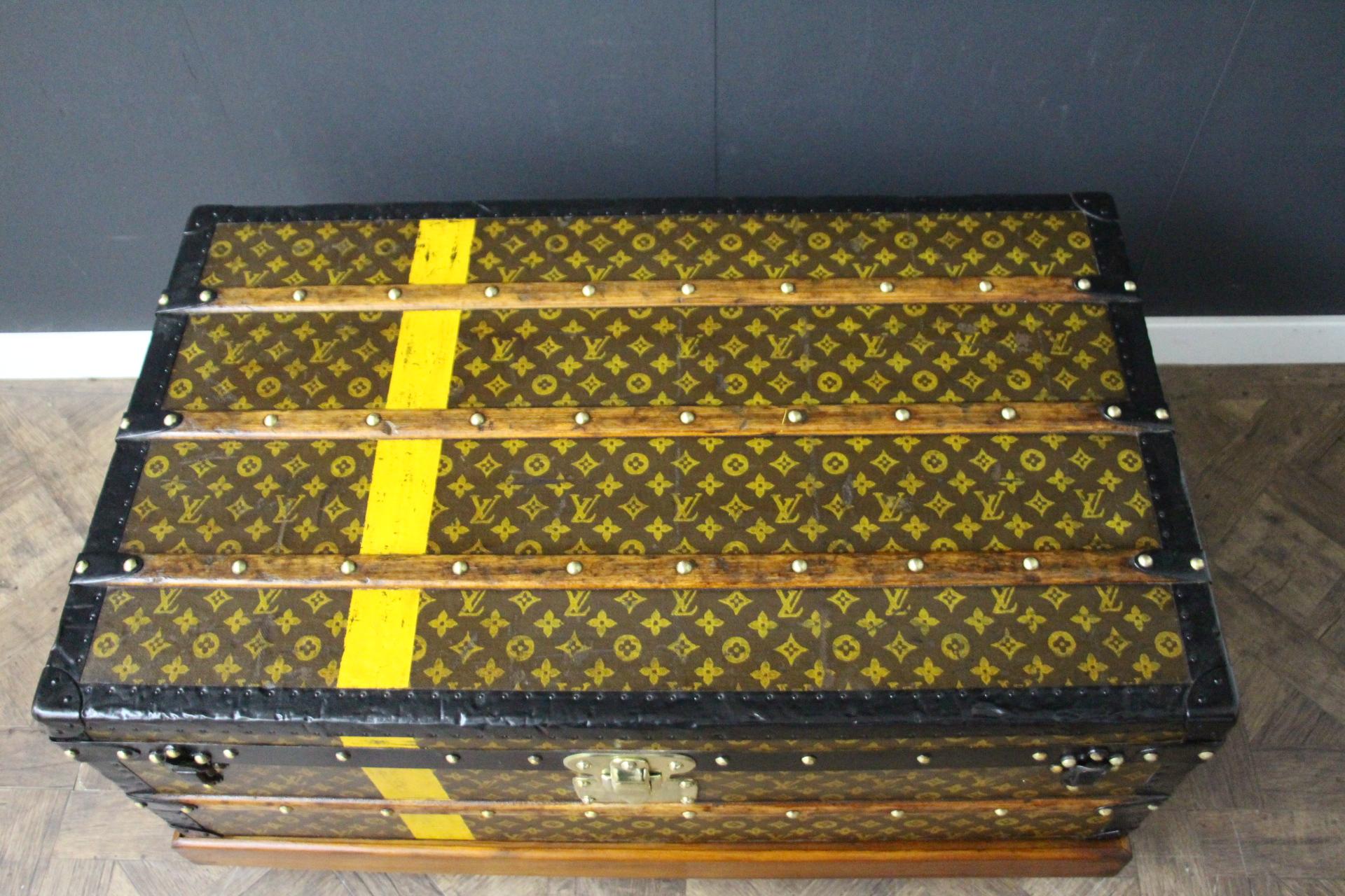 This very nice Louis Vuitton trunk features hand stenciled monogram canvas , black steel trim and Louis Vuitton stamped solid brass lock and and steel clasps, as well as black steel side handles. Its patina is warm and elegant. It has got hand