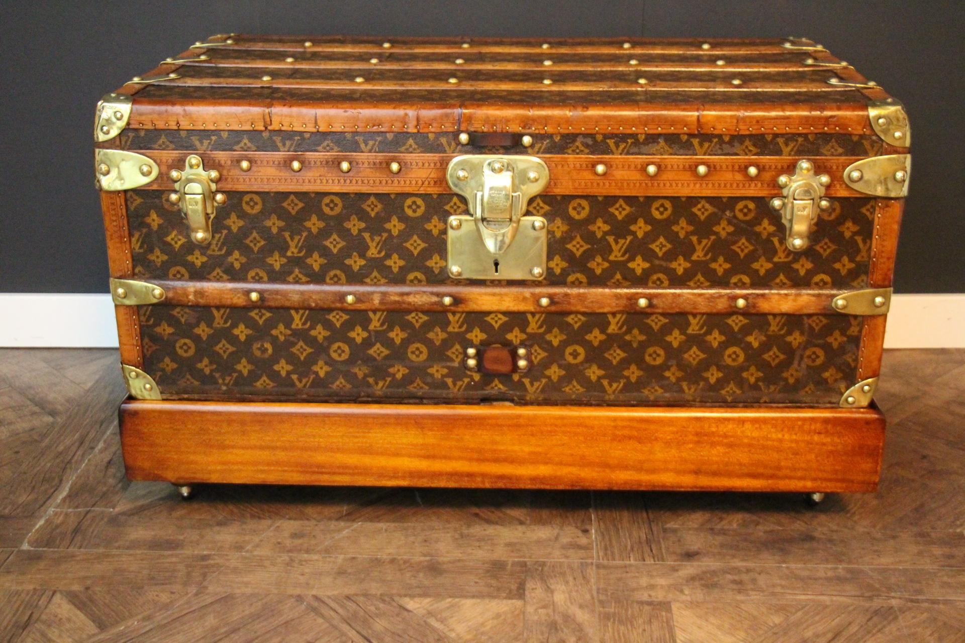 Very nice Louis Vuitton hand stenciled monogram canvas featuring light honey color login trim and LV stamped solid brass locks and clasps, Louis Vuitton stamped studs as well as large leather side handles. Its patina is warm and elegant.
Interior is