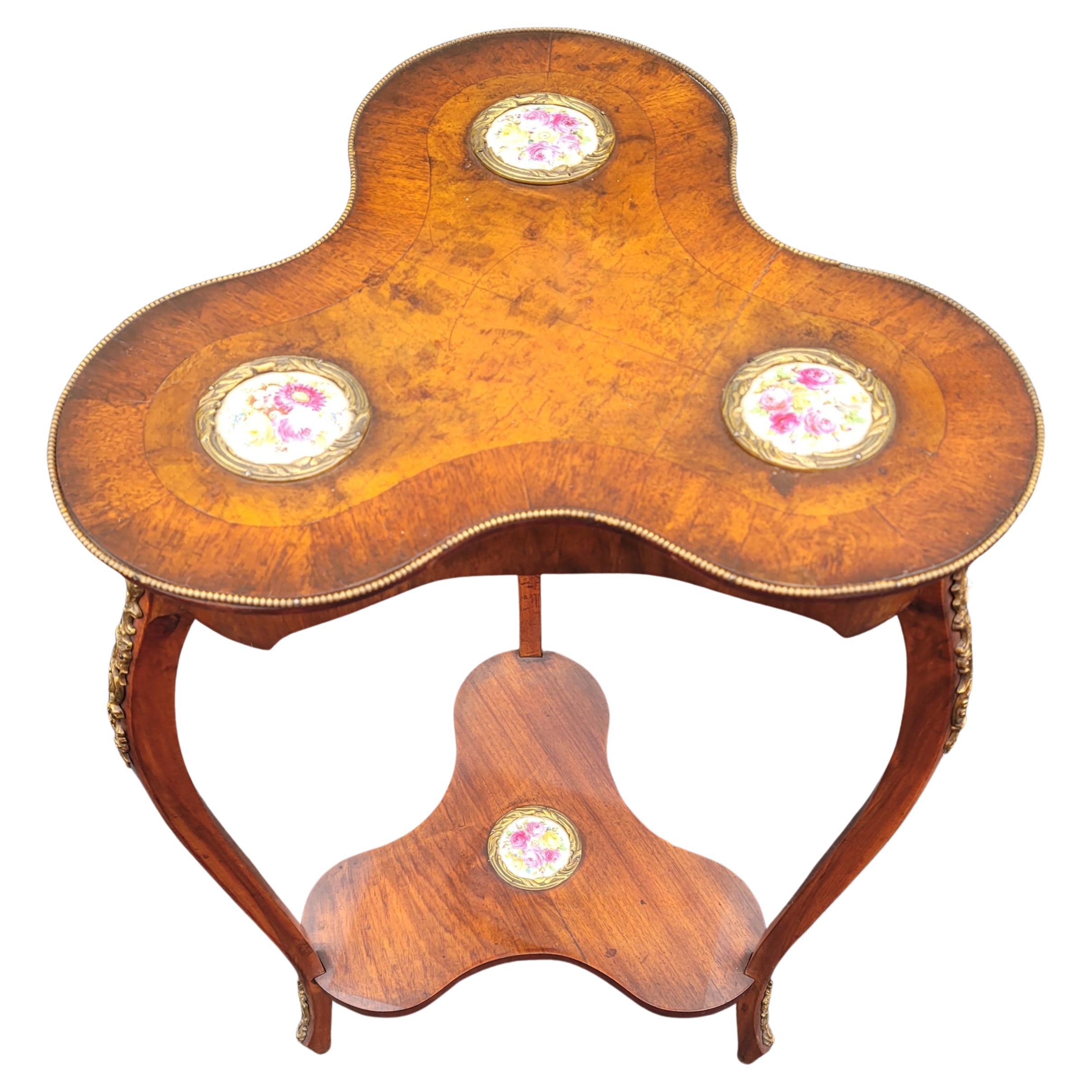 A unique 1920s Louis XV Style Ormolu & Porcelain insets Burled Walnut Trefoil Side Table with 4 individually designed porcelain insets. 
Measures 18