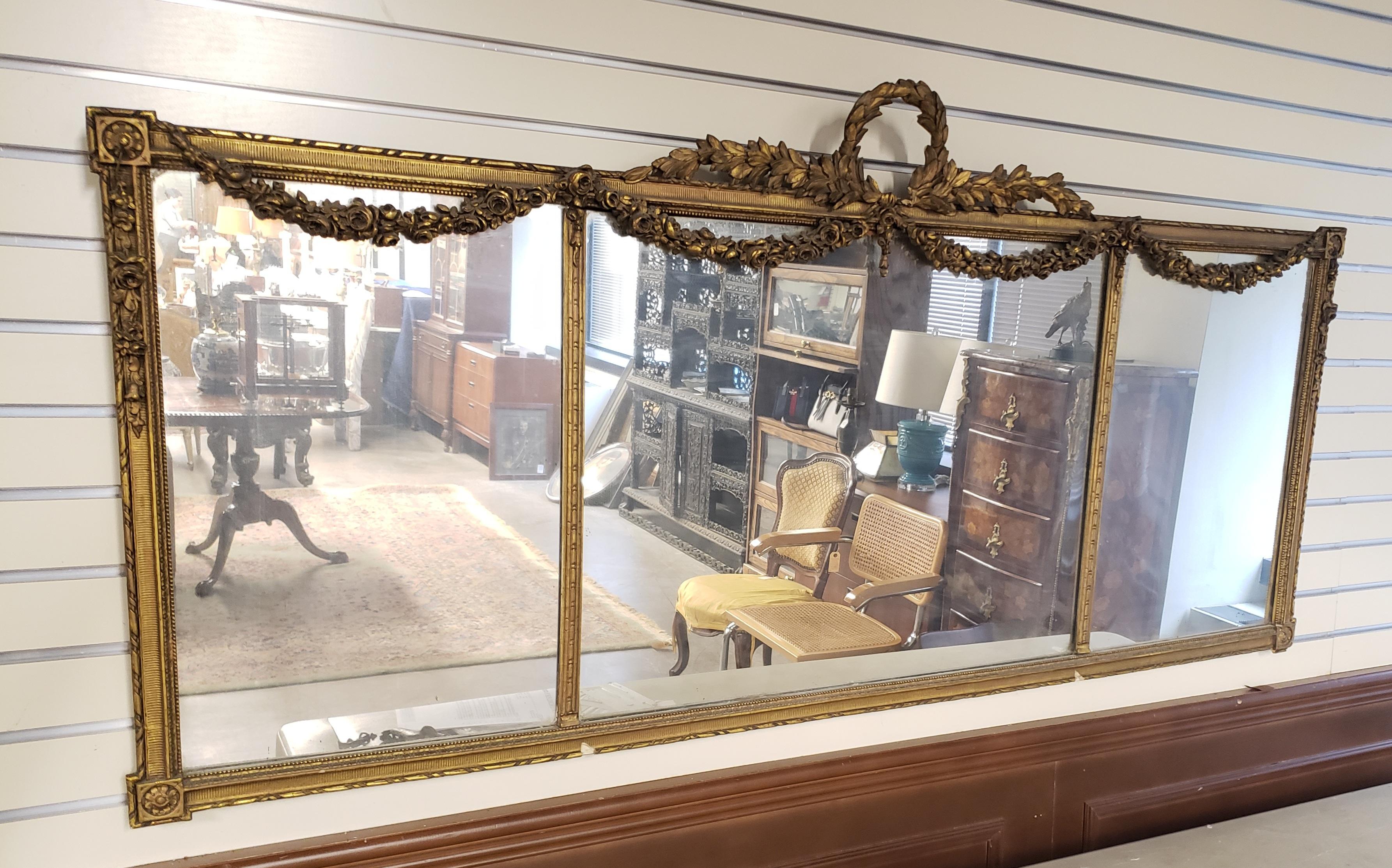 1920s Louis XVI Style carved gilt wood ornate three panel over-mantle mirror. Two available.
meas
