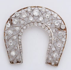 1920s "Lucky" Diamond Horseshoe within a Horseshoe Platinum and Gold Brooch