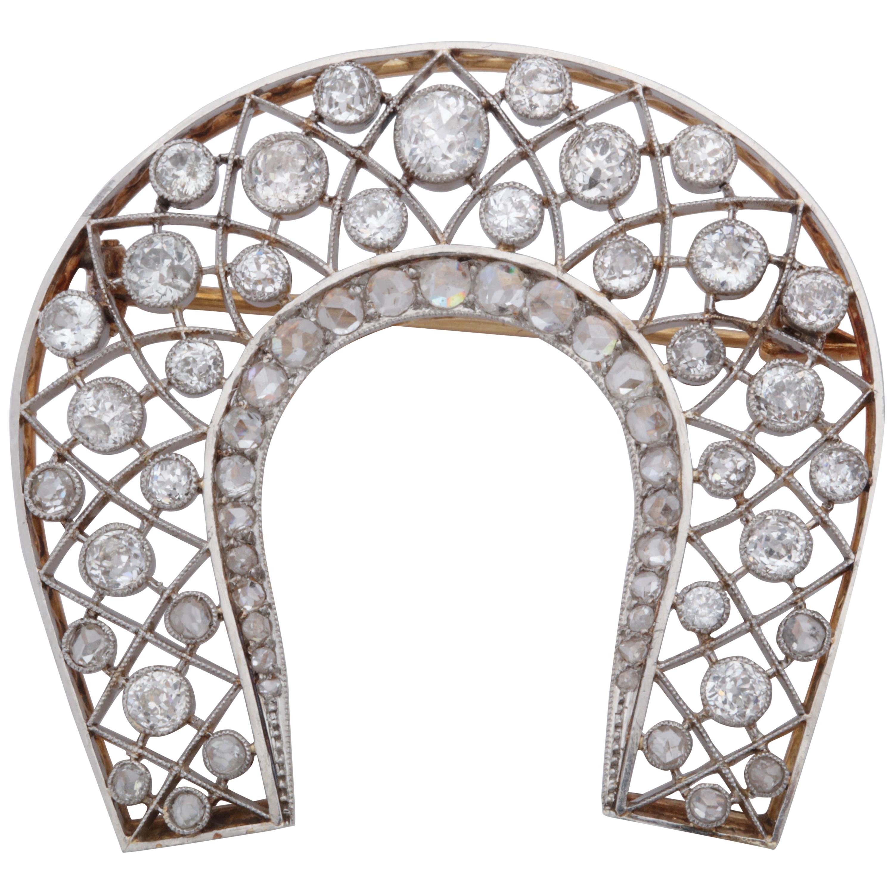 1920s "Lucky" Diamond Horseshoe within a Horseshoe Platinum and Gold Brooch