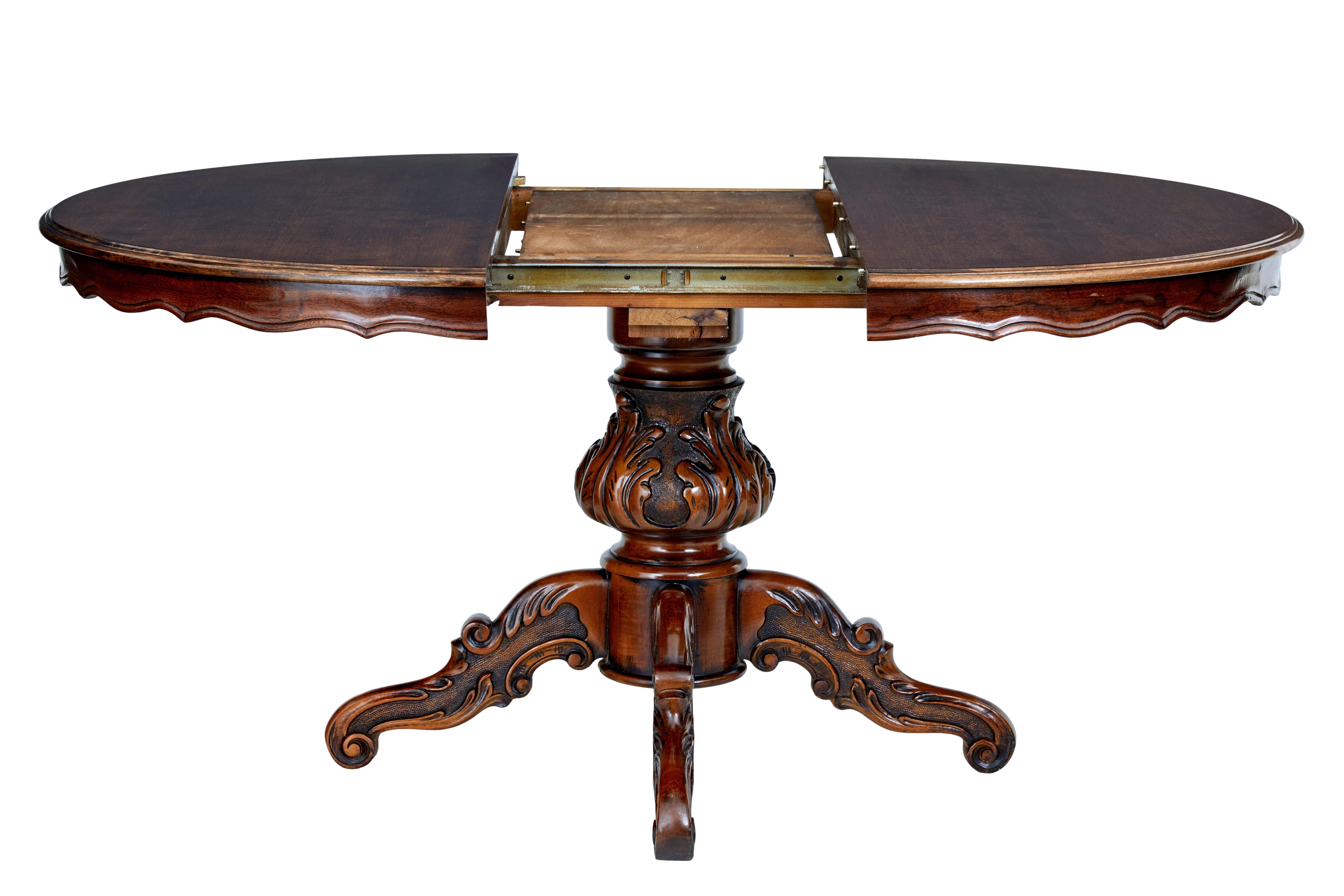 Fine quality Scandinavian mahogany extending dining table, circa 1920.

Good quality piece of design which allows this table to function as a center table and a dining table.

Forming a circular shape of 47 1/4