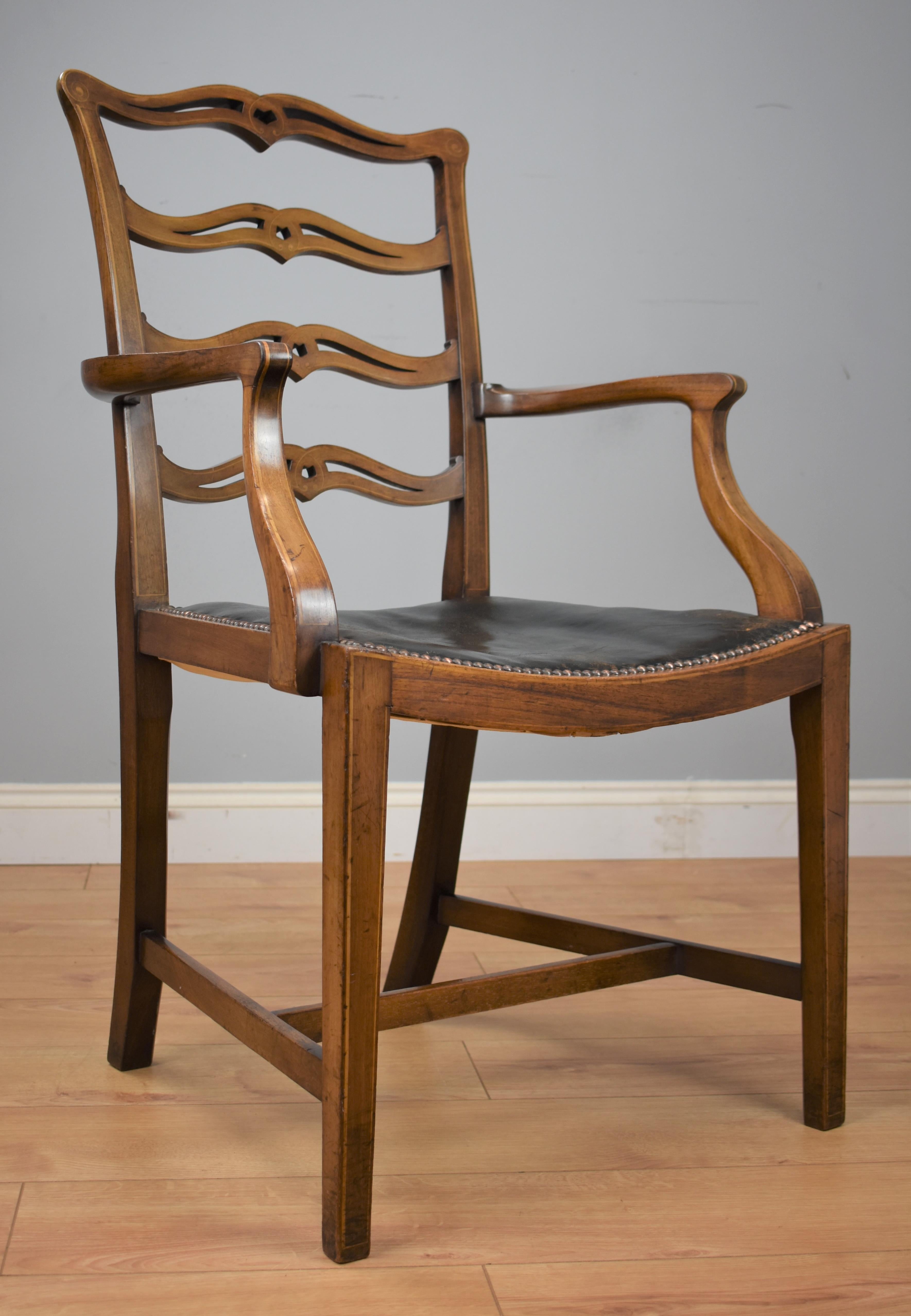 1920s mahogany desk chair in good original condition with a nicely shaped bar back and original leather seat with buttoned surround, shaped arms standing on tapered legs with centre stretcher.

    
    