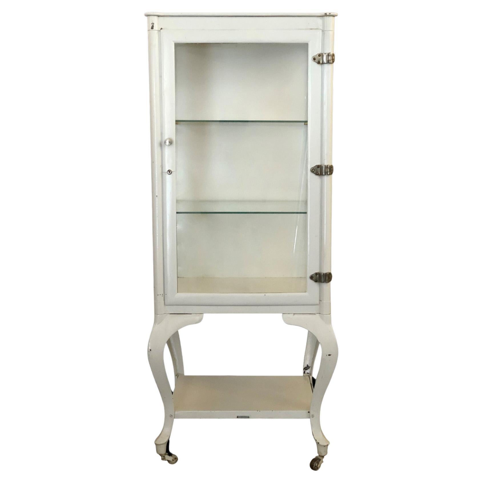 1920s Metal Medical Apothecary Storage with 2 Glass Shelves and Wheels For Sale at 1stDibs