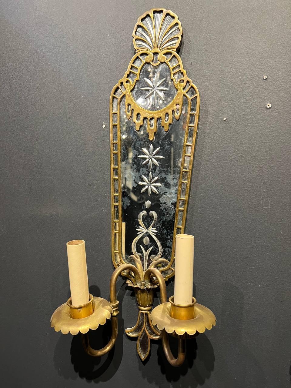 A pair of 1920’s mirrored back plate sconces with bronze fittings with two lights 
