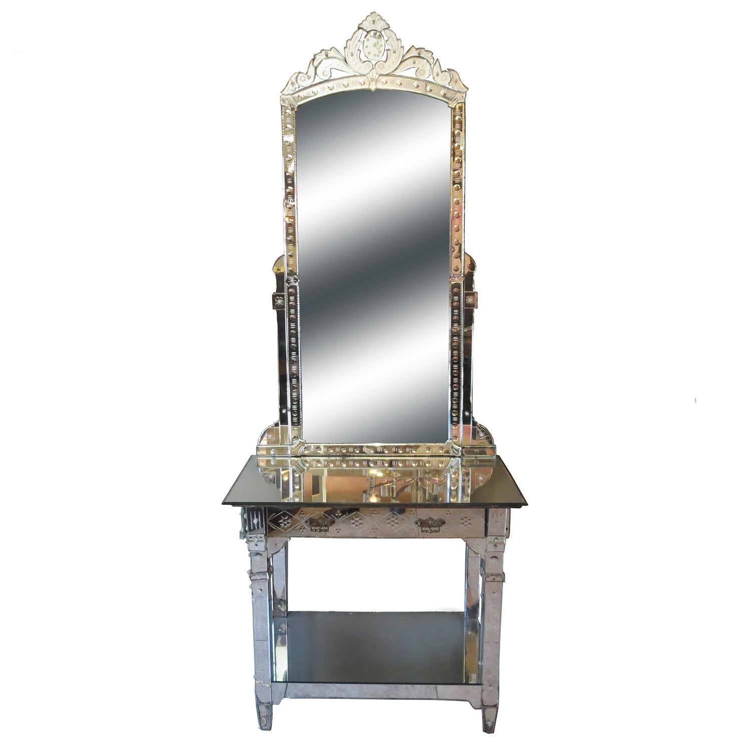 This glamorous mirrored vanity came from the Hollywood apartment of Bette Davis near Sunset Boulevard. It features multiple panels of beveled mirror, decorated with floral etched designs. There is overall wear and some chipped panels. A few of the