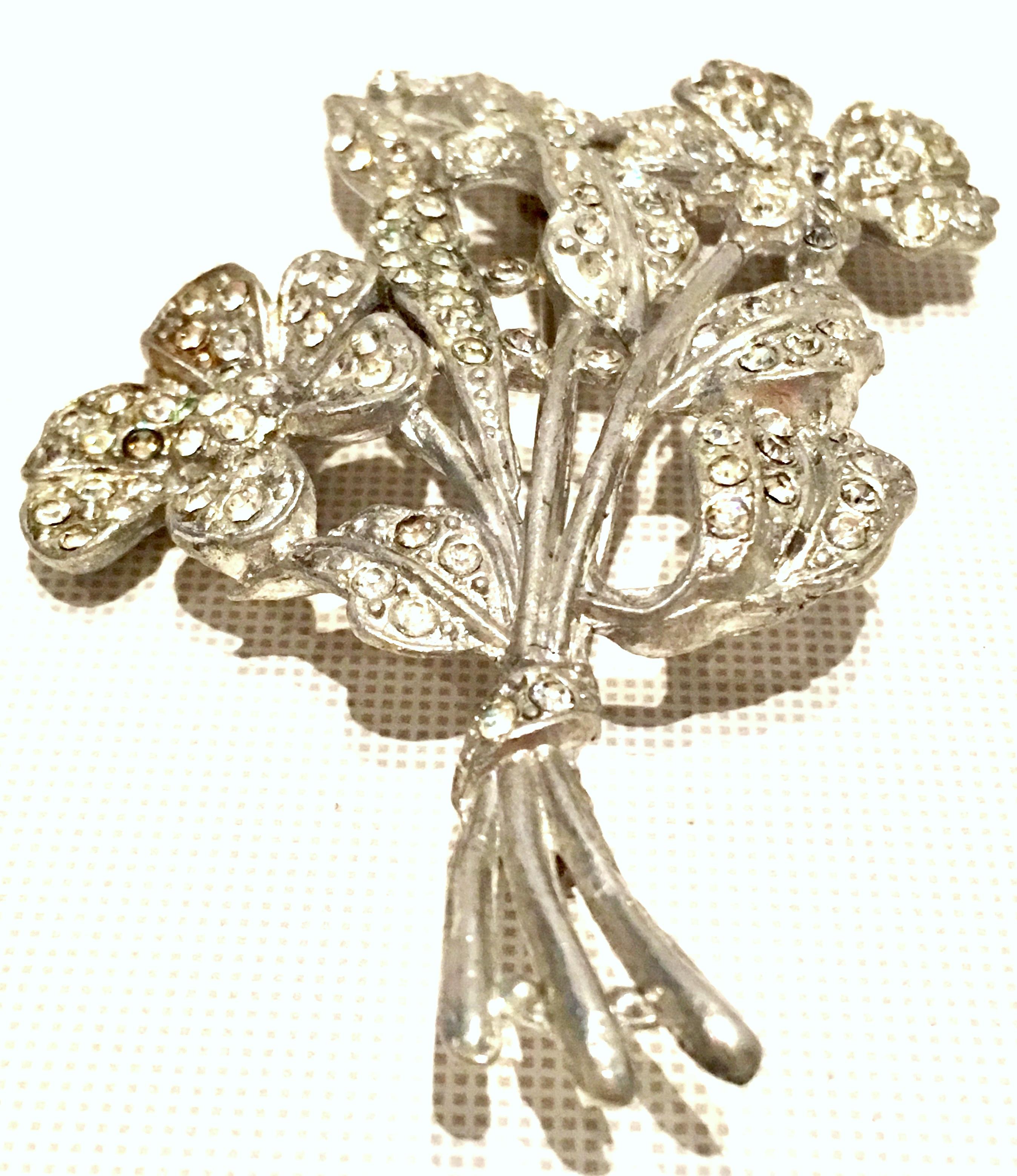 Antique 1920'S Monumental Silver Pot Metal & Crystal Clear Bezel Set Austrian Crystal Flower Brooch.
This dimensional work of art is dimensional and intricate in detail. The projection of this 3.5