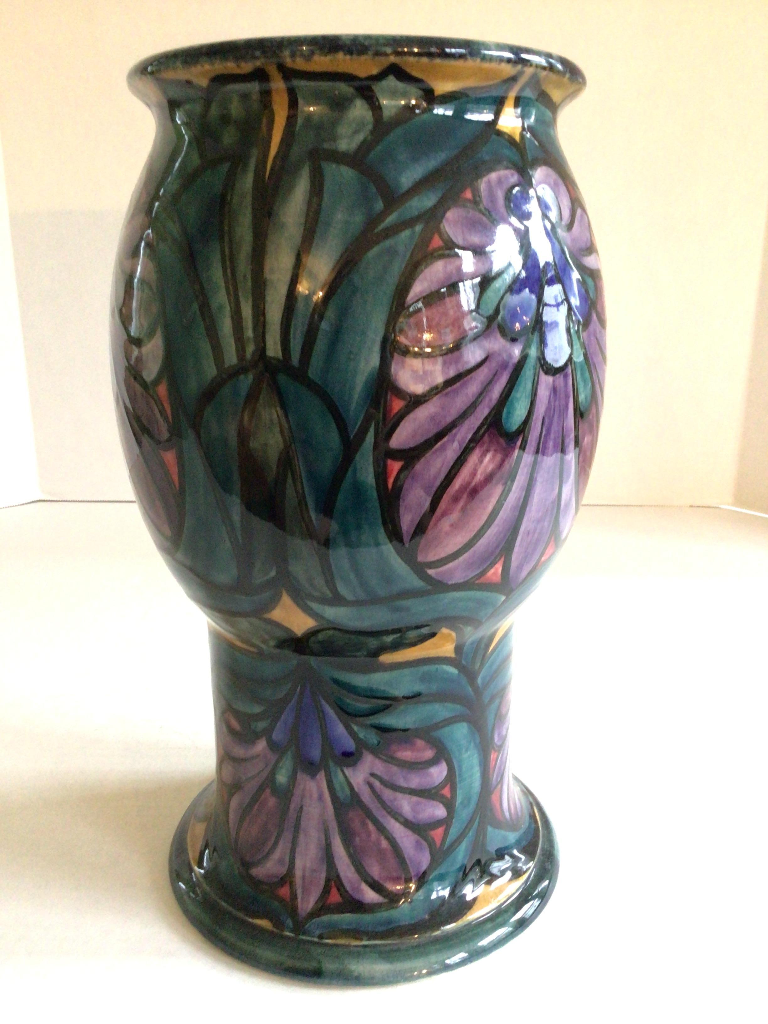 Dating between 1918 and 1926 this Morrisware Painted Ceramic Vase has a stamp and printed makers marks on the bottom with signature: George Cartlidge 
Some craquelure, minor chips (as shown)
10-3/4
