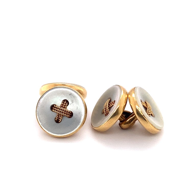 Item Details:
Gemstones: Mother of Pearl
Metal Type: 18 Karat Yellow Gold 
Weight: 7.91 grams

Item Features:
These Beautiful 1920s cufflinks feature Mother of Pearl on both ends of each cufflink. Each Mother of Pearl disc has 4 holes in which 3
