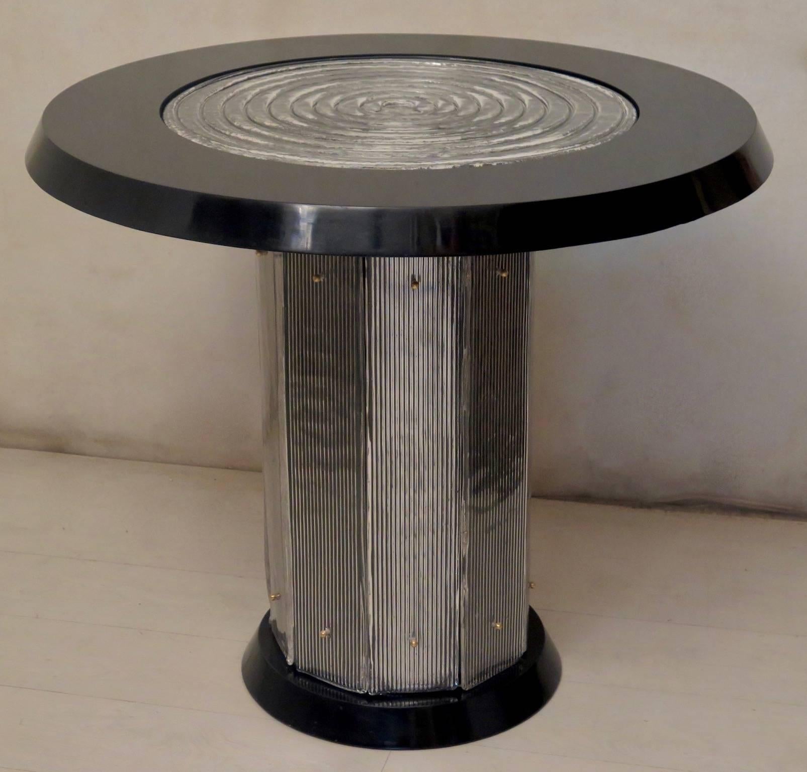 Italian Art Deco cards and tea table. Wooden structure polished in black lacquer; on the top there is a large Murano art glass disk, it is smaller in diameter than the entire top, so as to leave a frame all around the table. Finally, the plan has a