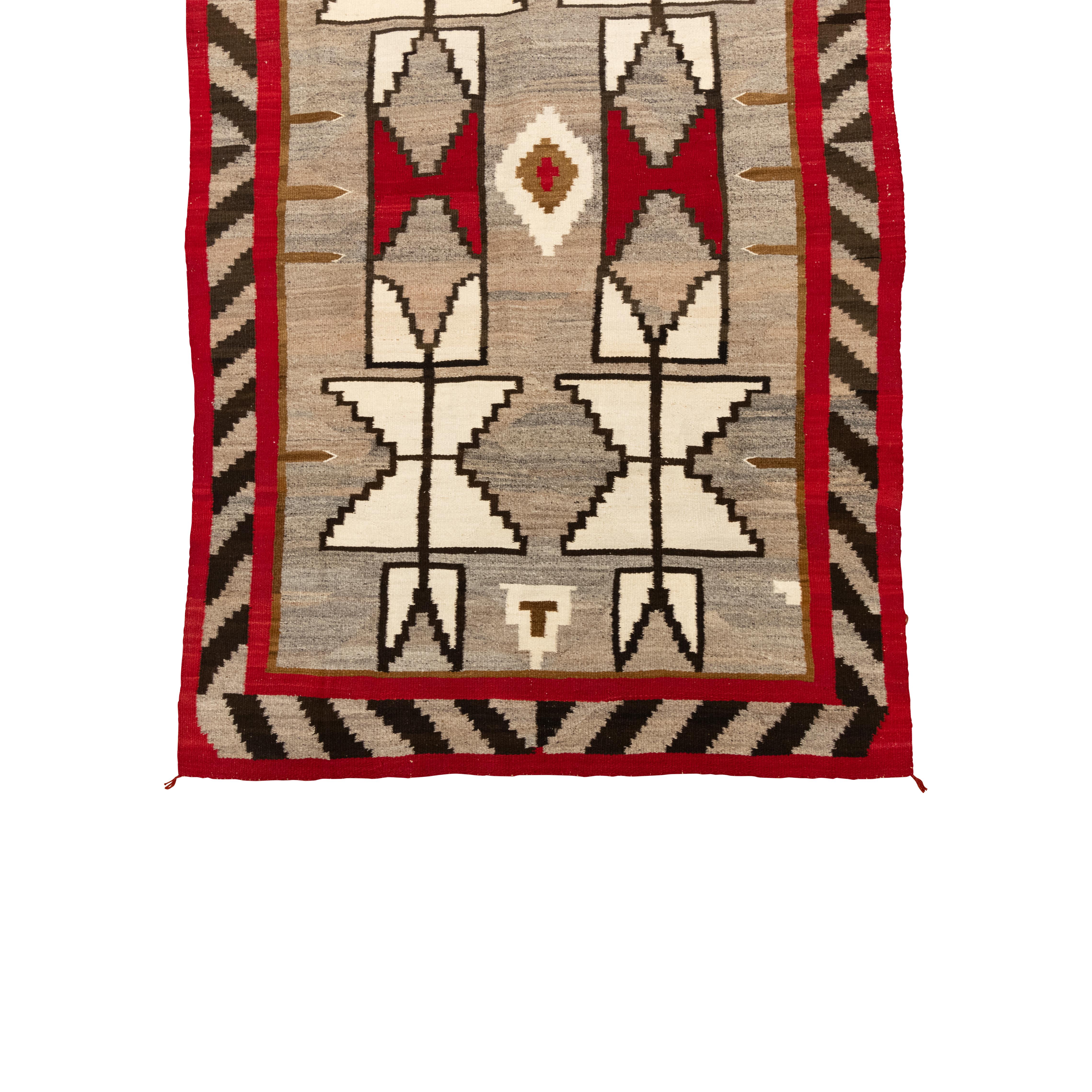 Navajo Crystal area weaving with stylized feathers on sides, 