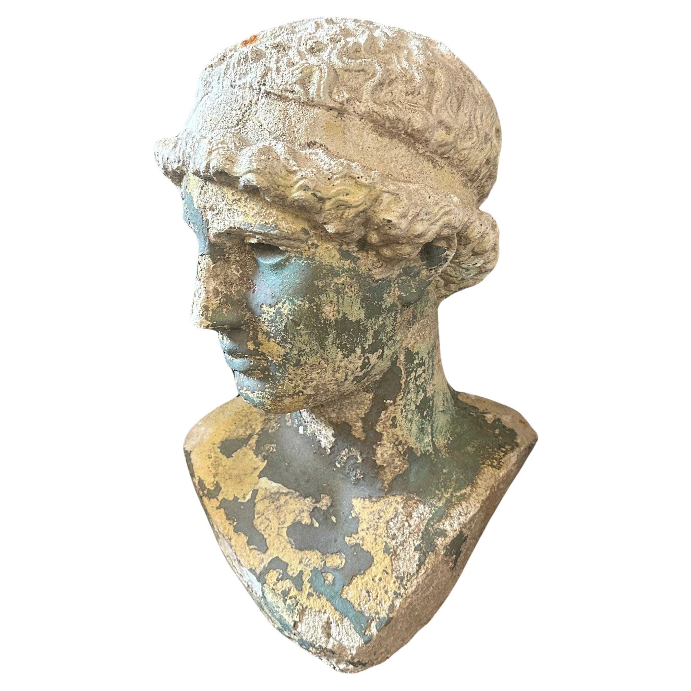 An Italian plaster bust of Minerva with characteristics typical of the Neoclassical style that emerged in the late 18th century and continued into the 19th century. The bust typically made from plaster, a common material for Neoclassical sculptures