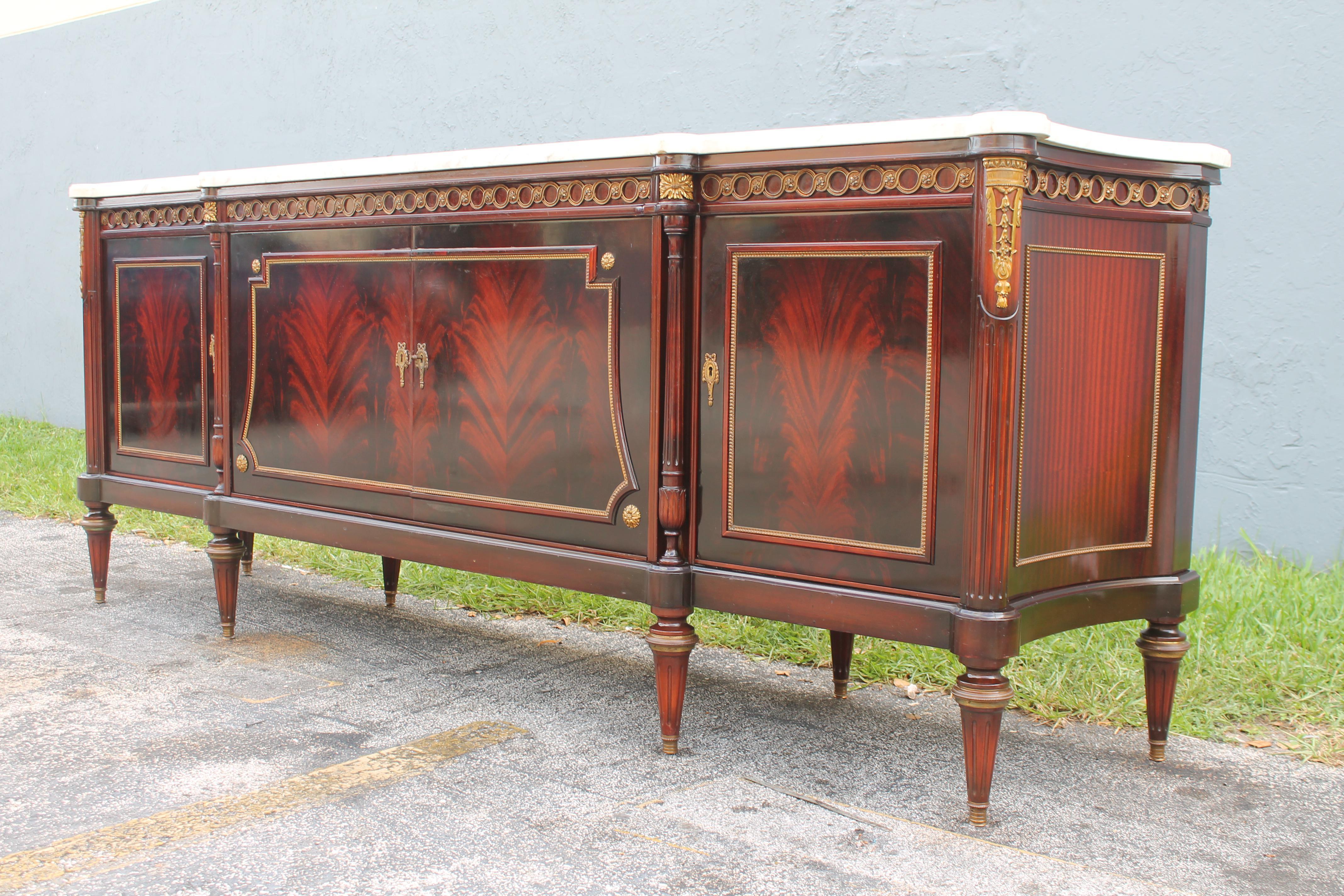 Neoclassical 1920's Neoclassic style Marble Top Flame Mahogany Buffet/ Sideboard/ Credenza For Sale