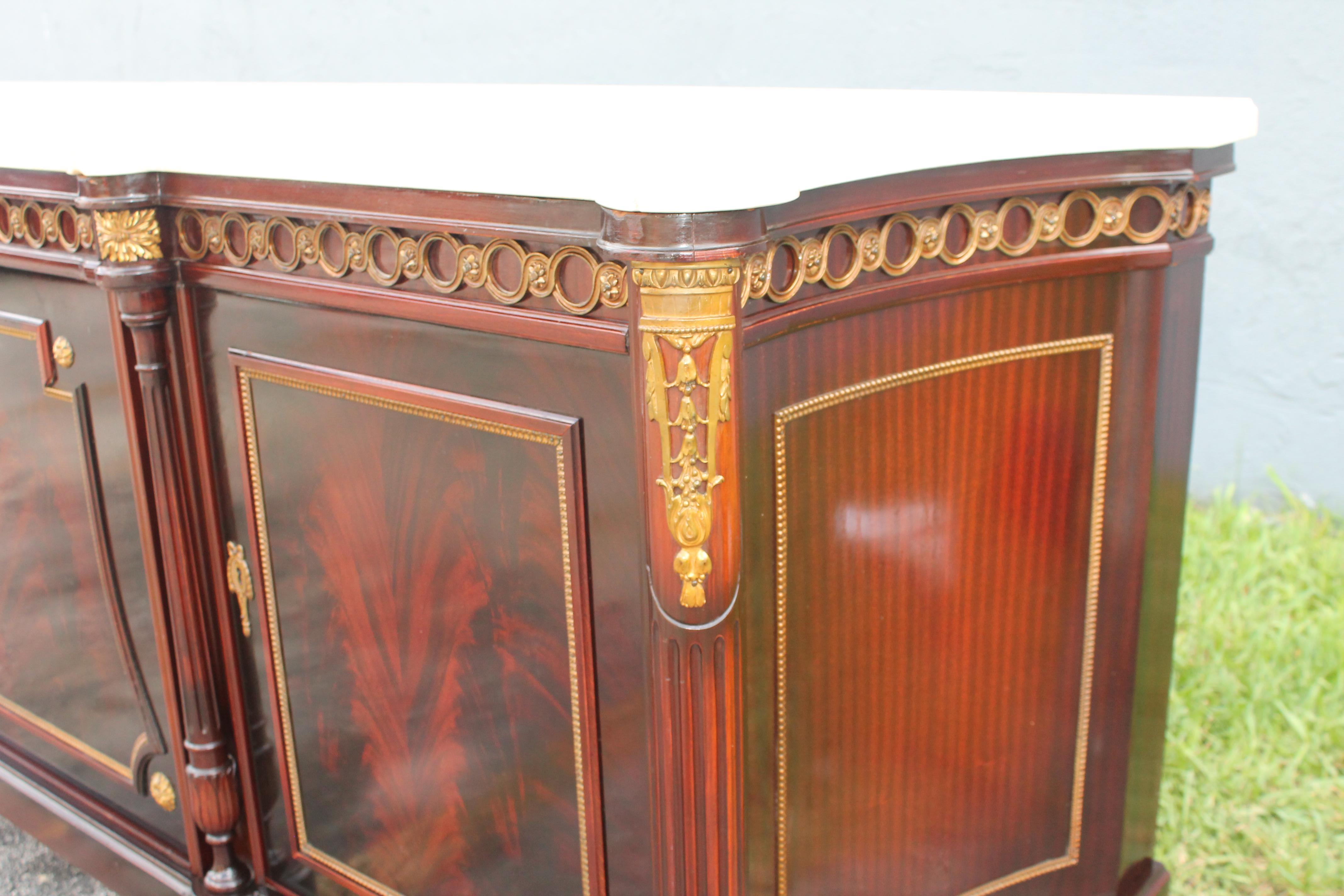French 1920's Neoclassic style Marble Top Flame Mahogany Buffet/ Sideboard/ Credenza For Sale