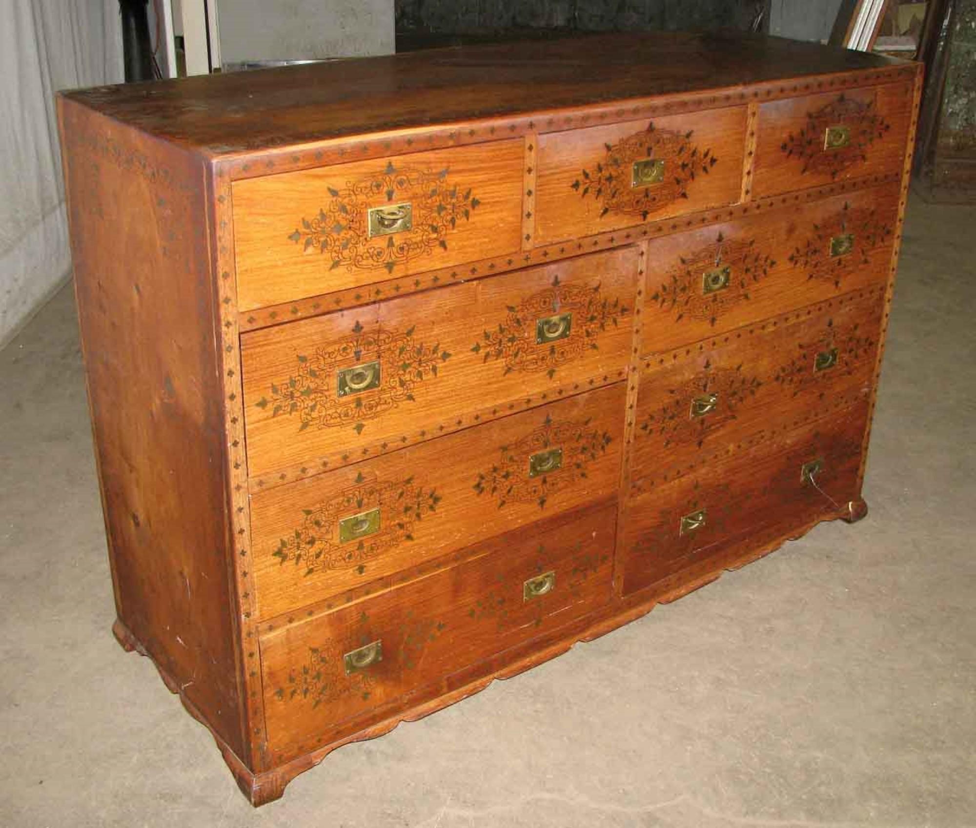 Large 1920s wood dresser with nine drawers. Detailed with inlaid brass and brass pulls. Hand painted. This can be seen at our 333 West 52nd St location in the Theater District West of Manhattan.