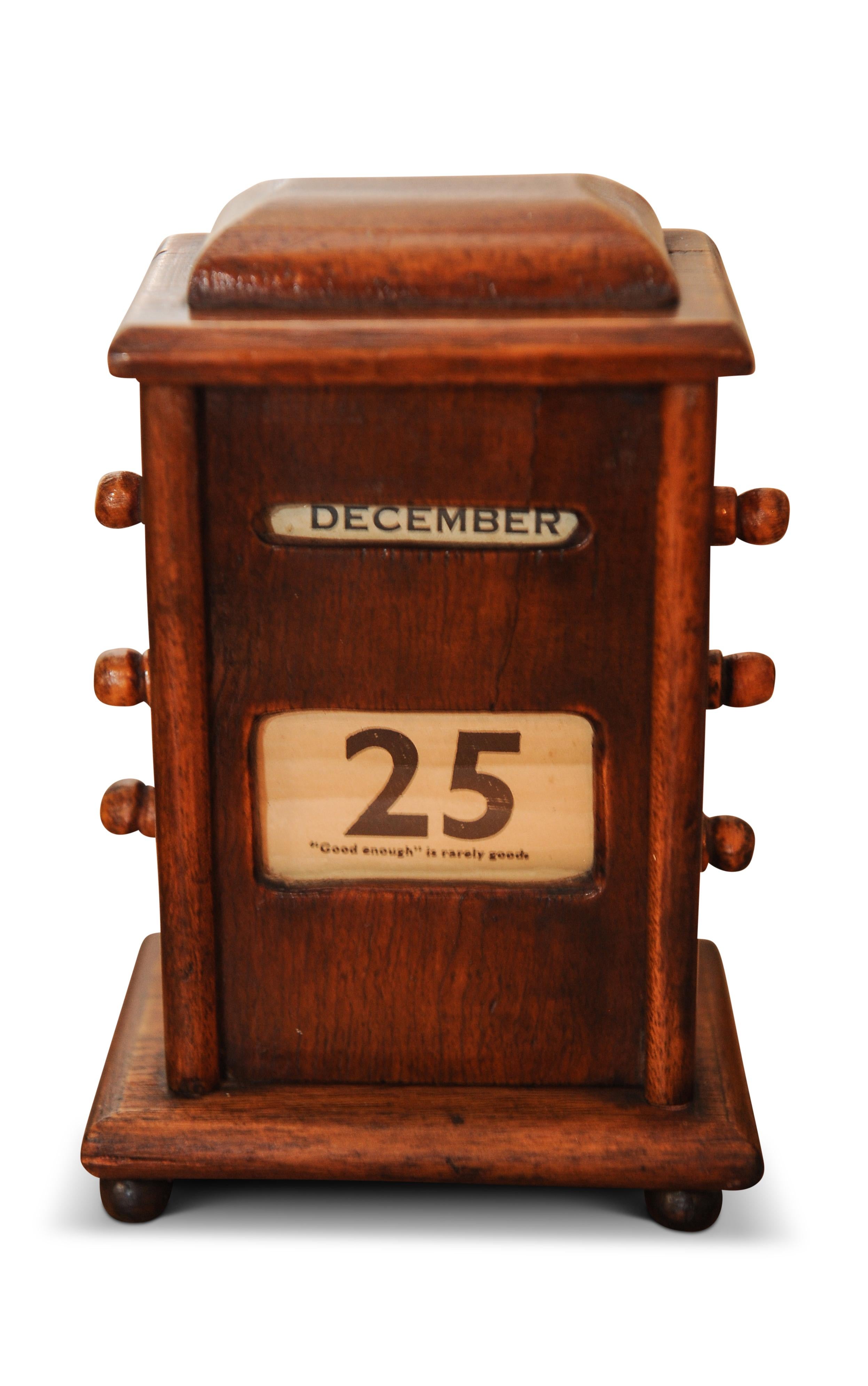 1920s oak desk top perpetual calendar with rotating dials for month, day, year.

 Desk accompaniment that tells the date and even includes sayings for each day by famous people.