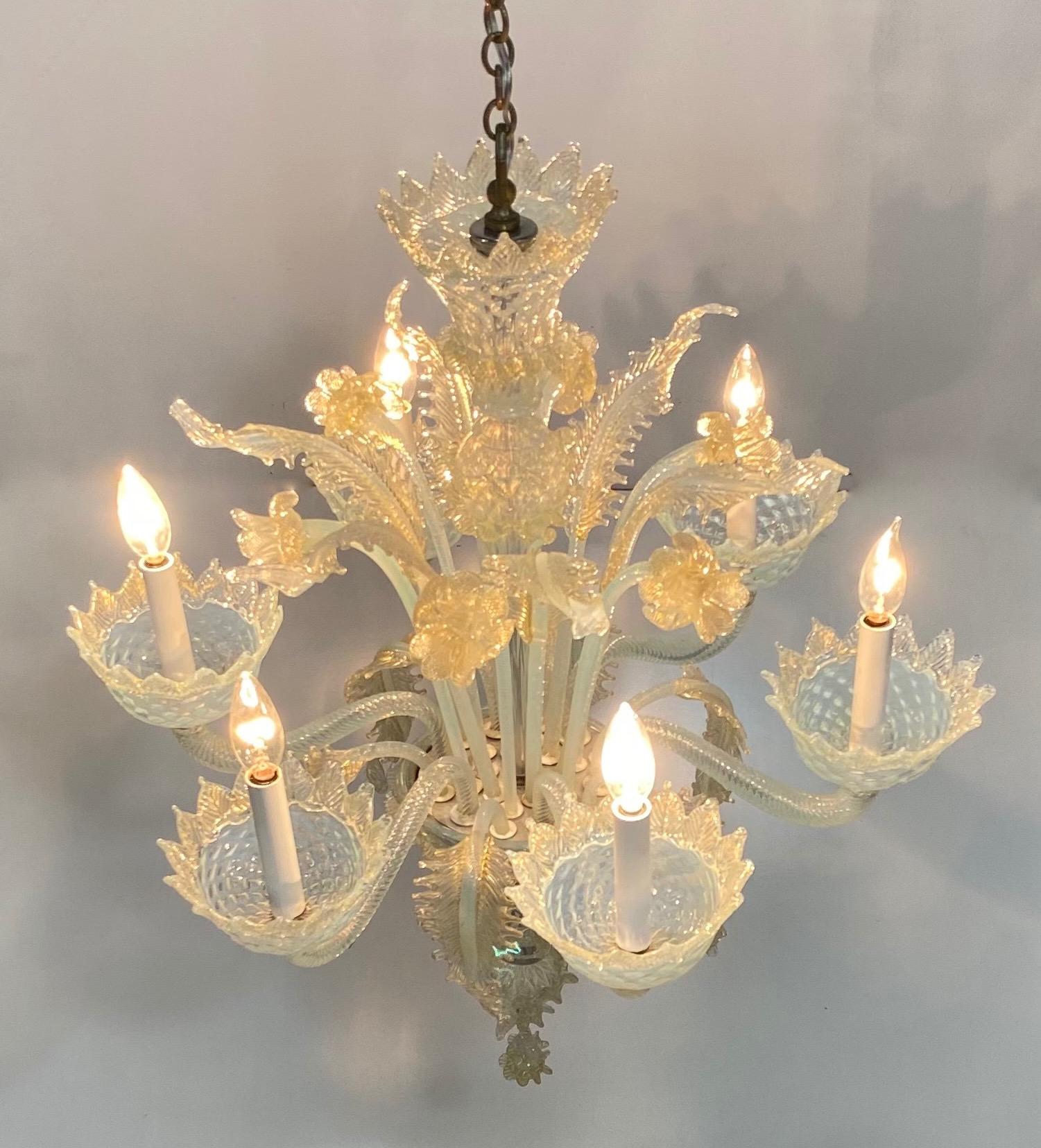 An exceptional large scale opaline color Murano glass chandelier.
Completely cleaned and re-wired.
A few glass fronds have been professionally repaired (not a distraction or noticeable).
Truly stunning, emitting a beautiful and welcoming glow