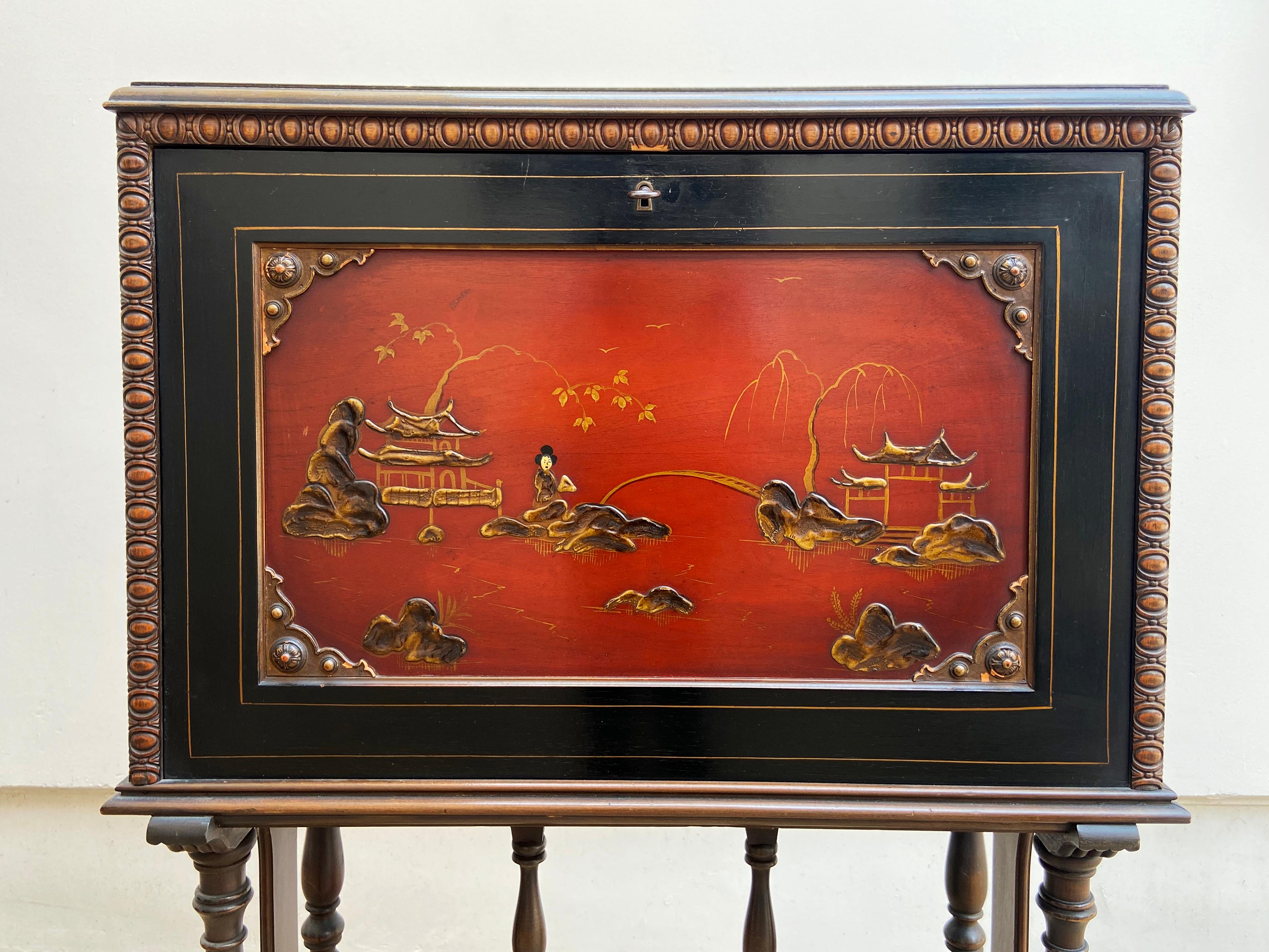Carved wood and hand painted writing desk, c. 1920 by the historic Rockford Furniture company of Illinois. This uncommon style is from Rockford's line of Chinoiserie furniture. Original key included. 

This wonderful piece was acquired from the