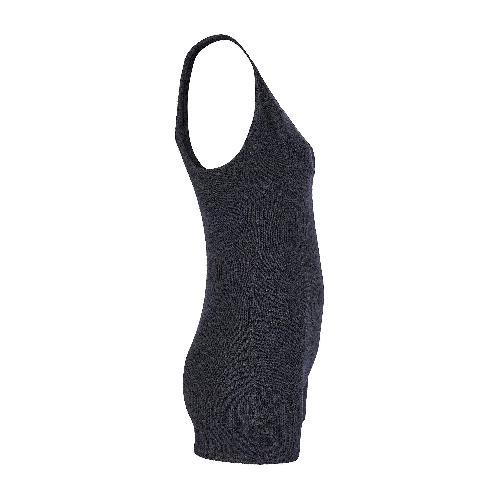 Dating back to the mid 1920s, this swimsuit is woven from a medium weight black stretch wool. It has a chunky ribbed texture with thick woven seams. The straps are thick and support a sports-bra like top. The body is cut from one piece of cloth with