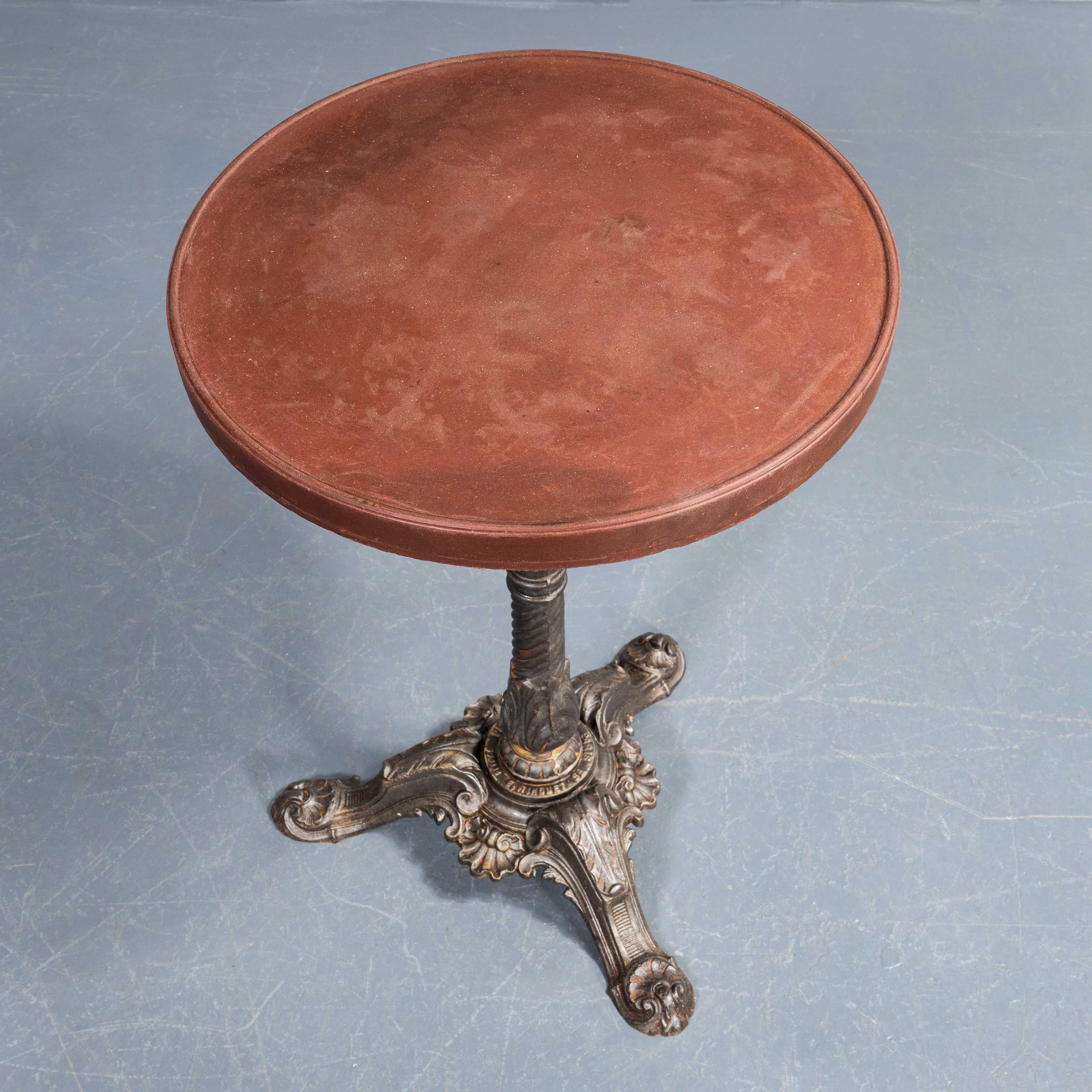 1920's Original French Cast Bistro Table - Pierre Ouvrier. 
Original French cast base table from the turn of the century. Original cast base with the foundry markings and superb detail. The top is the early Bakelite. Knee Clearance: 66cm

Workshop
