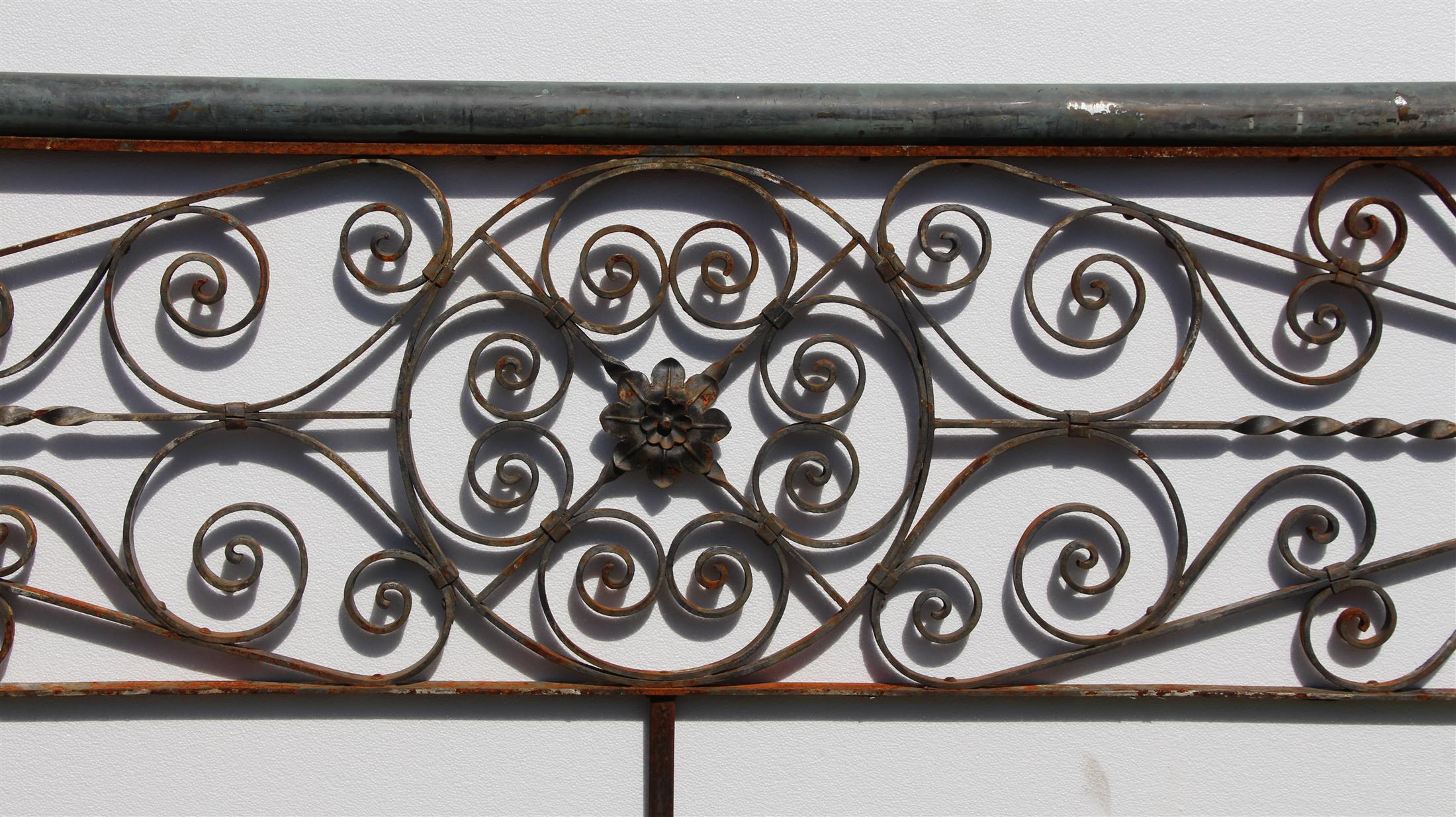 1920s original ornate balcony railing with amazing hand-wrought iron detail and a hollow metal top. Has rust. Please note, this item is located in our Scranton, PA location.
