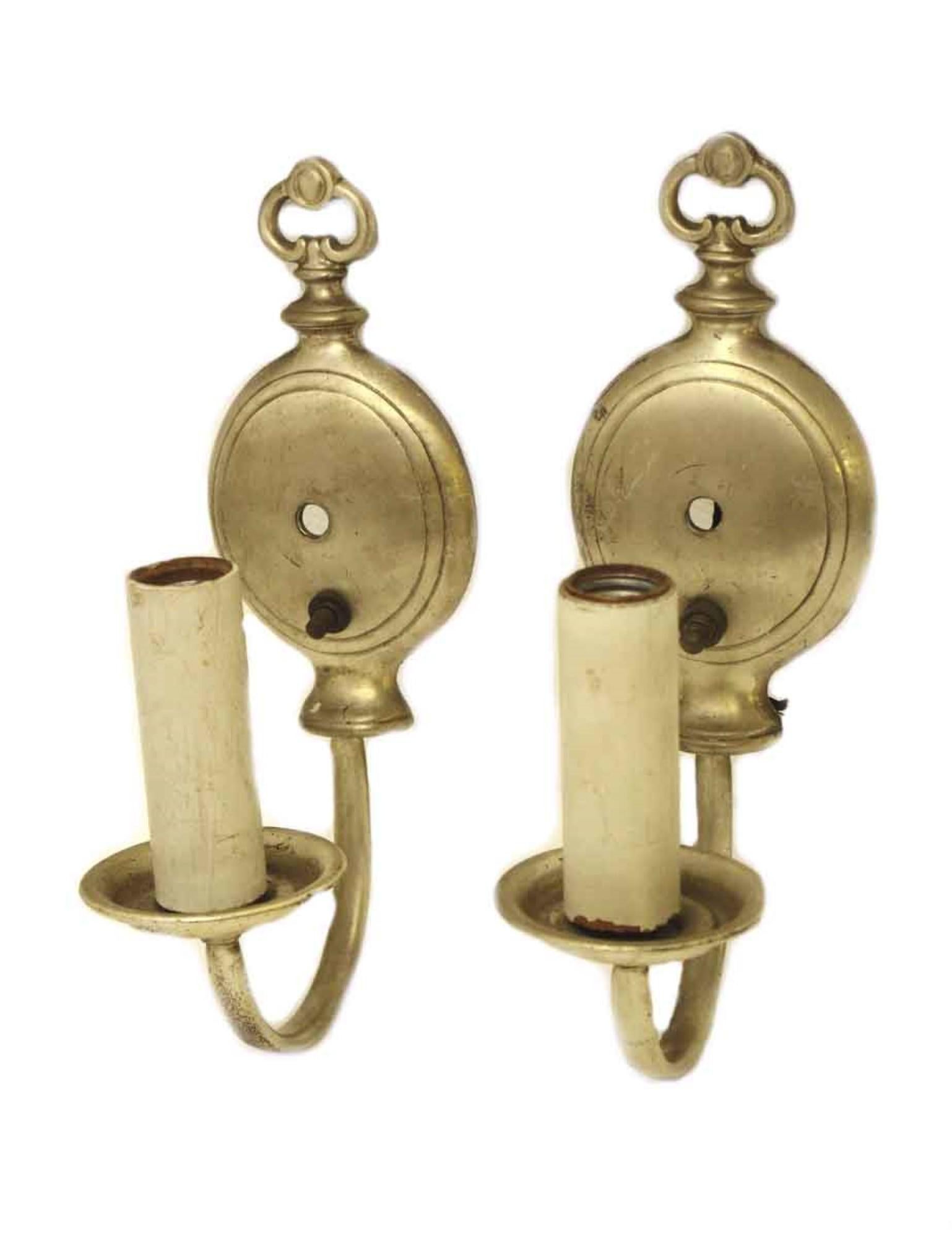 1920s silver plated solid brass pair of one-arm wall sconces. Priced as a pair. This can be seen at our 400 Gilligan St location in Scranton, PA.