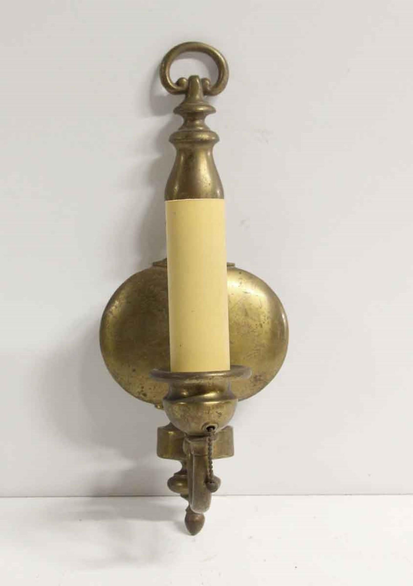 1920s pair of Federal style antique brass single arm sconces. This can be seen at our 400 Gilligan St location in Scranton, PA.