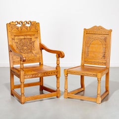 1920's Pair of English Jacobean Revival Style Carved Golden Oak Wainscot Chairs