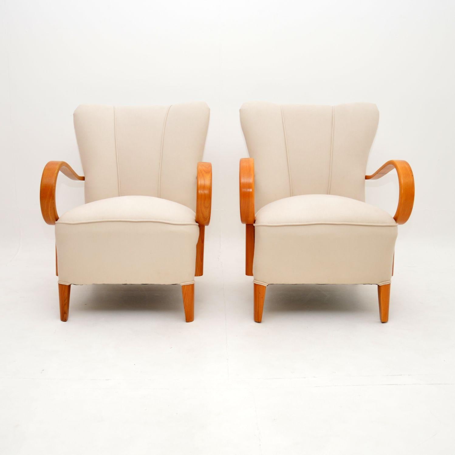 A stunning Swedish 1920’s pair of Art Deco armchairs with stylish and shapely elm frames. They were recently imported from Sweden, they date from the 1920-30’s.

They are of excellent quality and beautifully designed. The frames have scalloped
