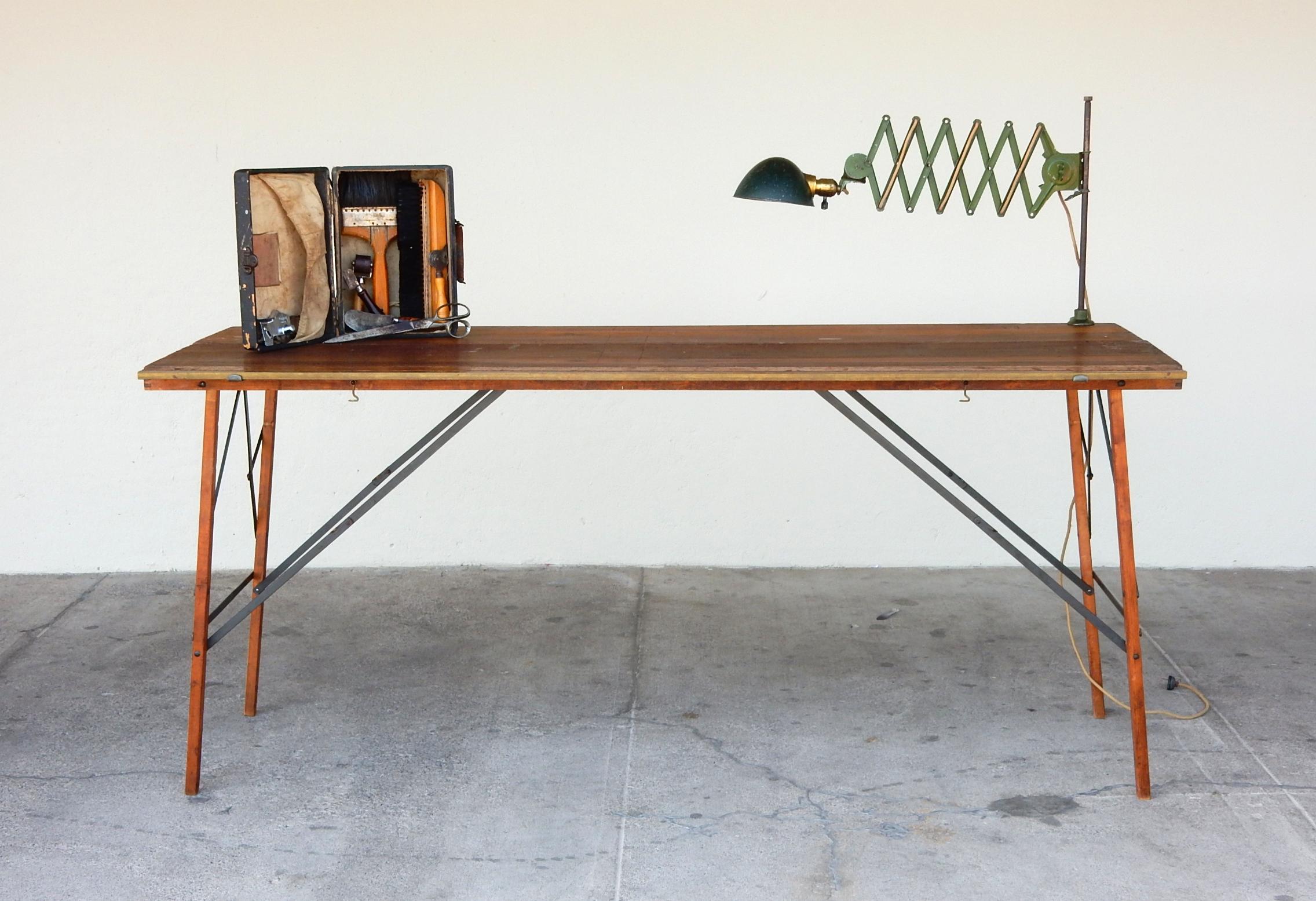 A complete paper hanging tradesmen tool set from 1920s-1930s.
Set includes a 6 foot steel and walnut folding table, brass and wood ruler/straight edge, small case with paste brushes, cutting tools and a clamp on, adjustable, scissor task