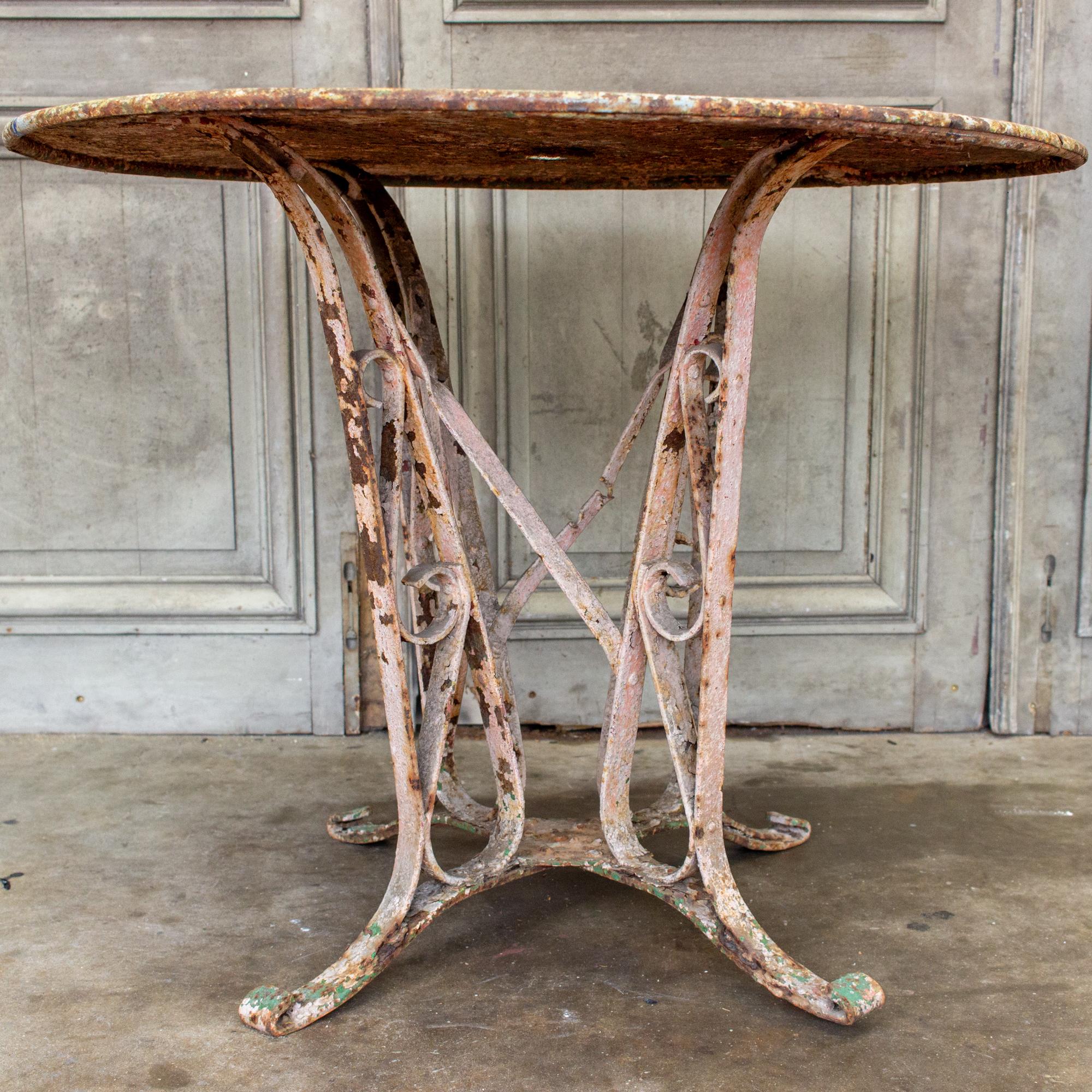 1920s Patinated French Painted Metal Garden Table with Worked Iron Base In Fair Condition In Houston, TX
