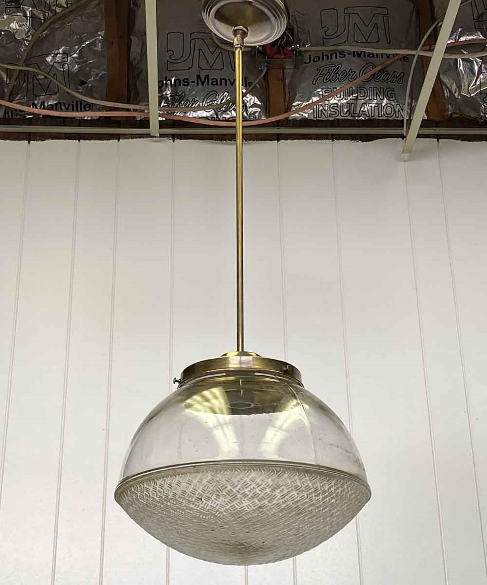 1920s glass globe fitted with a slender newly made brass pole fixture. The pole can be done in brushed nickel or steel at your request. This can be viewed at our Scranton, Pennsylvania location. Please inquire for the exact address.