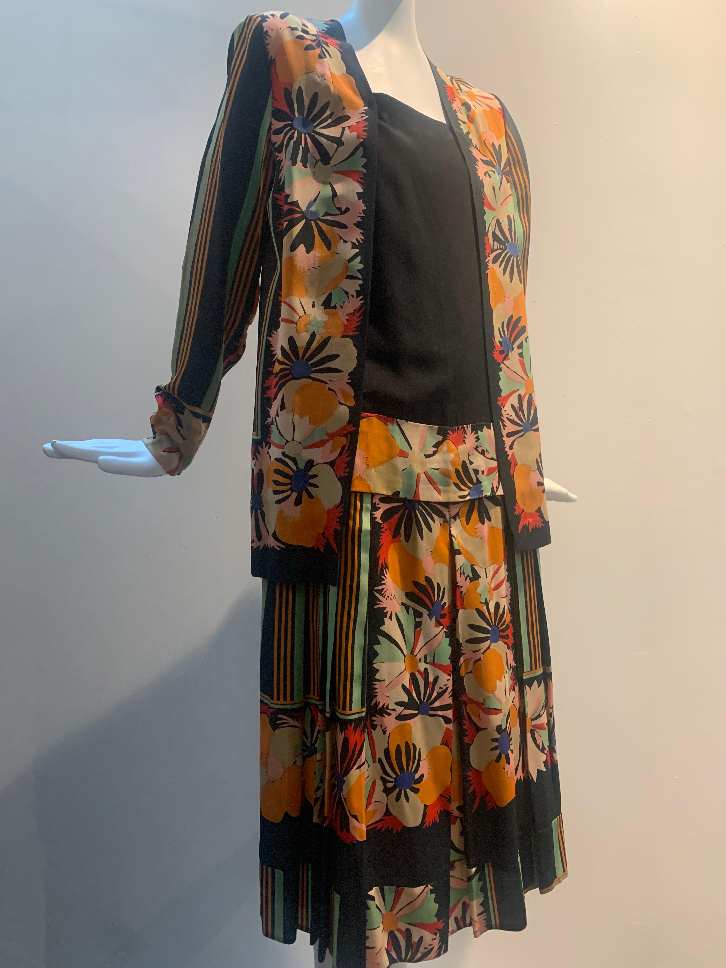 Exceptionally rare 1920s French Paul Poiret original print fabric Art Deco day dress in black silk with multi-color stylized floral and stripes. Built-in kimono-style jacket and pleated dropped waist, Chemise-style dress. Original tag, Made In