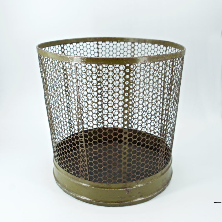 https://a.1stdibscdn.com/1920s-perforated-metal-industrial-factory-office-wastebasket-trash-can-green-for-sale-picture-5/f_9857/f_242358721624145217167/modern50_perforated_factory_trash_can3_master.jpg?width=768