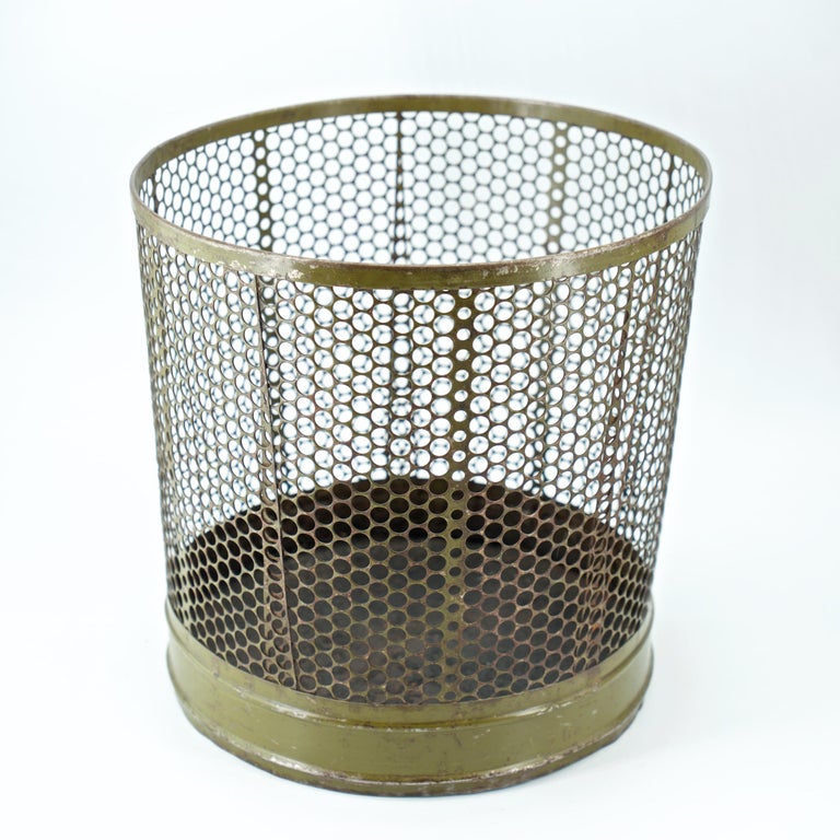https://a.1stdibscdn.com/1920s-perforated-metal-industrial-factory-office-wastebasket-trash-can-green-for-sale-picture-6/f_9857/f_242358721624145218095/modern50_perforated_factory_trash_can2_master.jpg?width=768