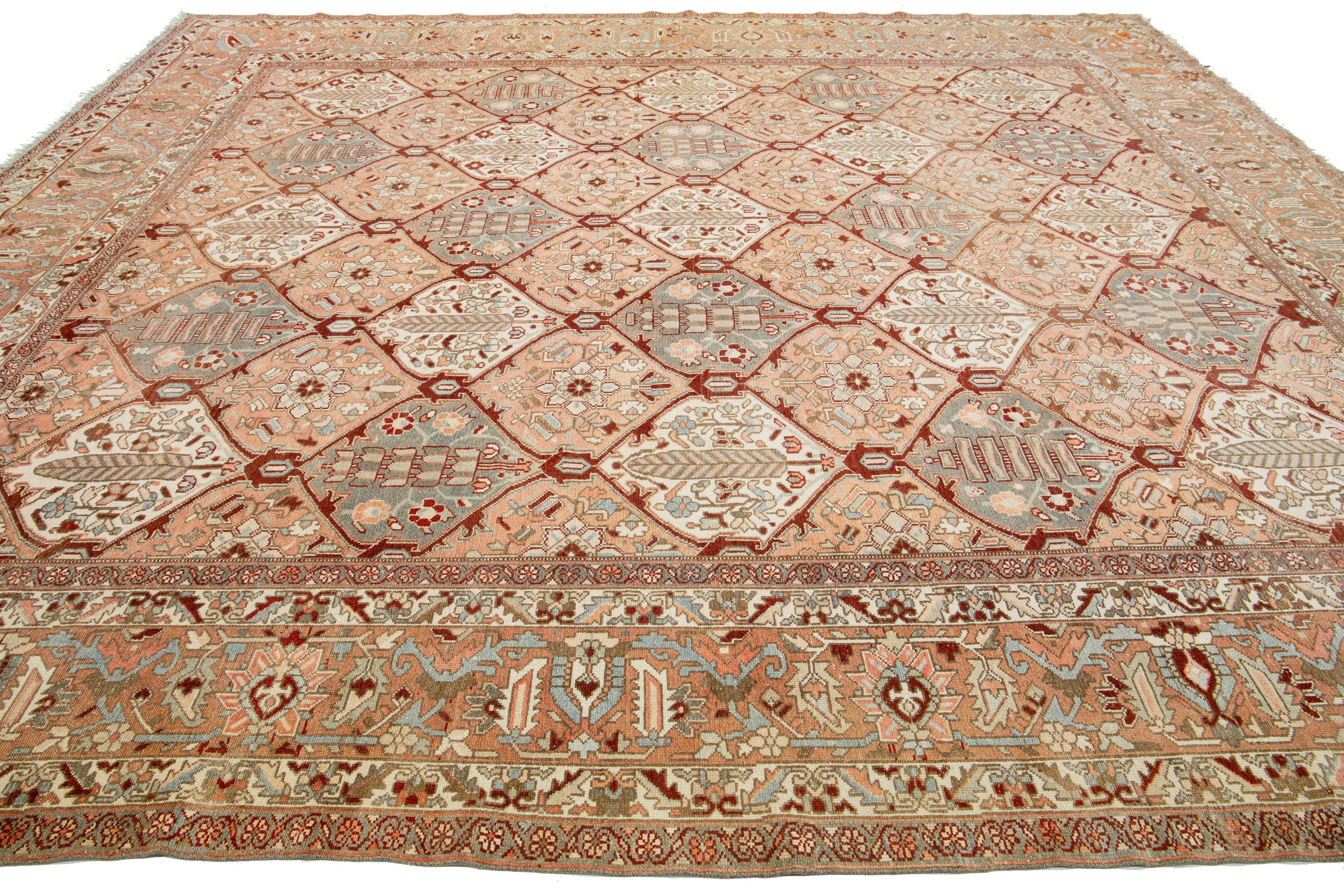 Hand-Knotted 1920s Persian Bakhtiari Peach Wool Rug Handmade With Allover Geometric Pattern For Sale