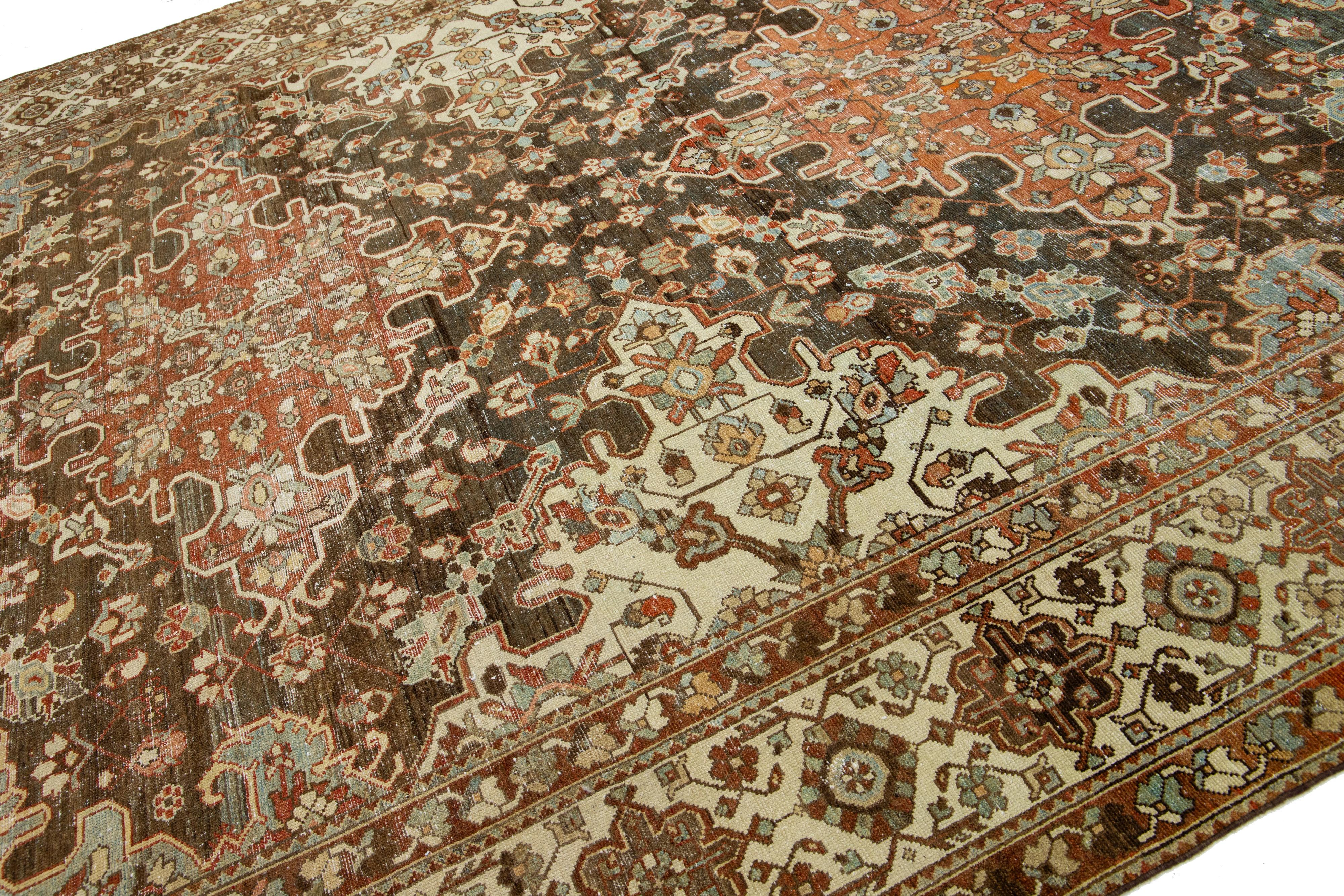 Islamic 1920s Persian Bakhtiari Red Wool Rug With Multicolor Floral Motif For Sale