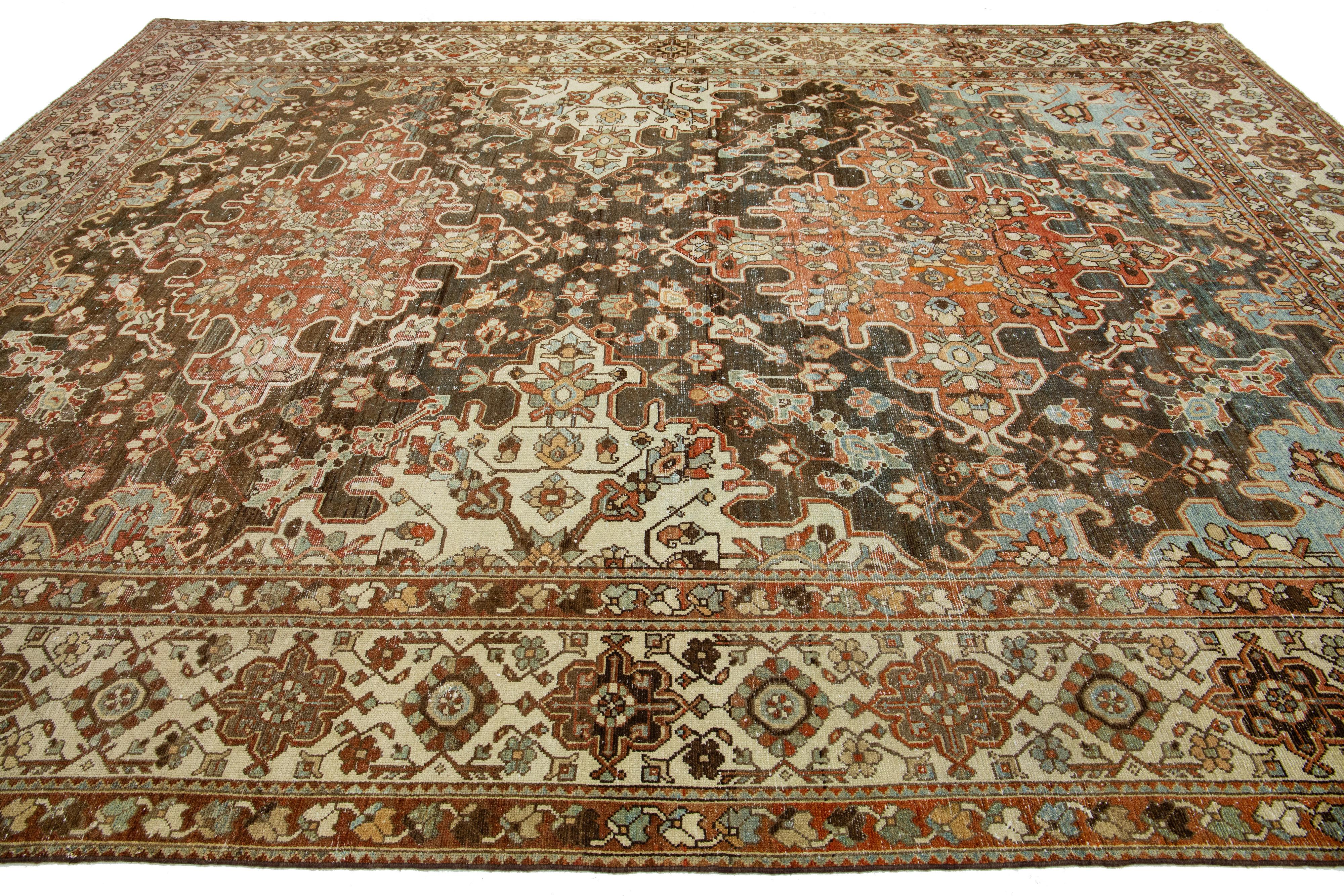 Hand-Knotted 1920s Persian Bakhtiari Red Wool Rug With Multicolor Floral Motif For Sale