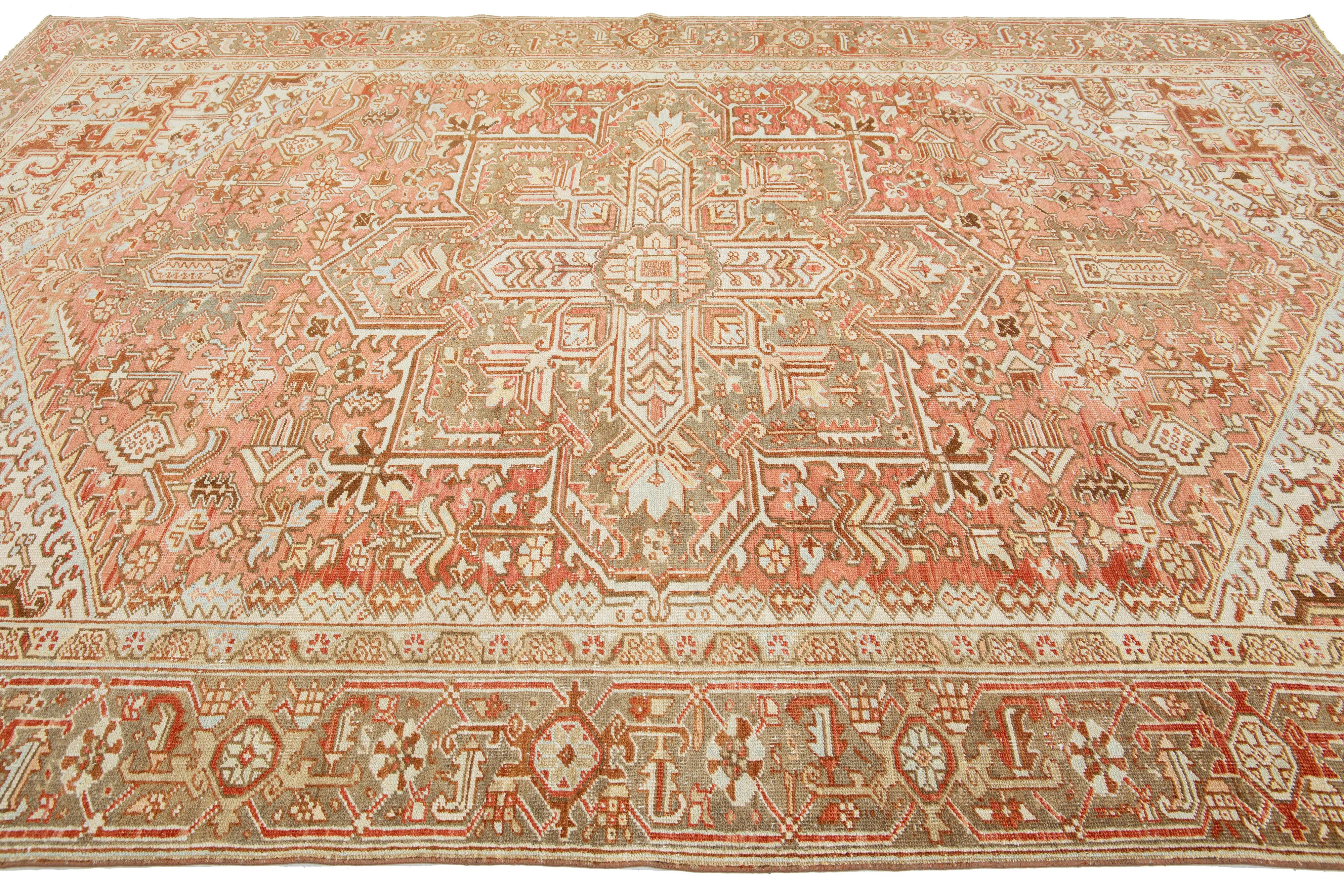 1920s Persian Heriz Antique Wool Rug In Rust Color Featuring a Medallion Motif In Excellent Condition For Sale In Norwalk, CT